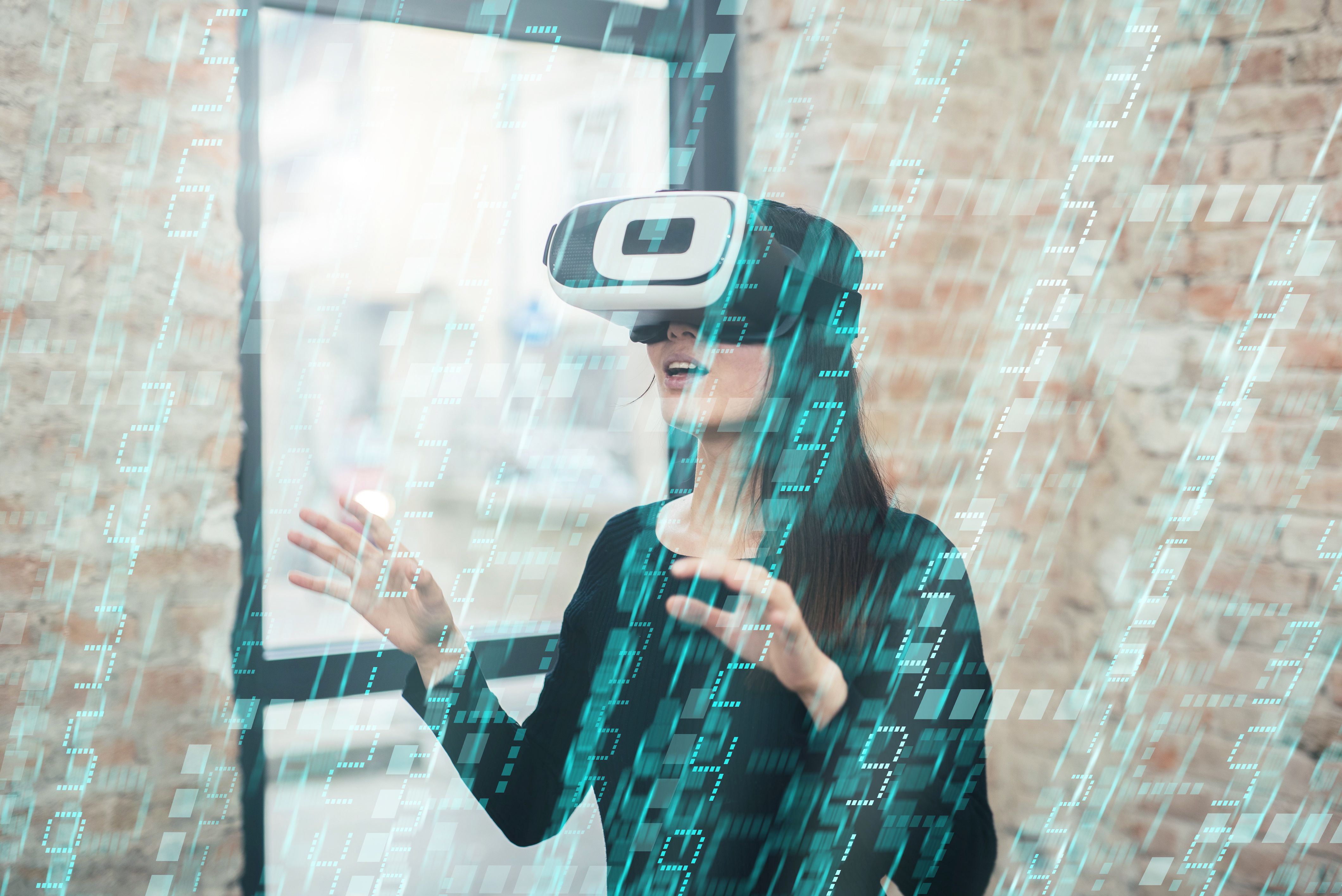 Young woman looks fascinated into Virtual Reality Headset Young woman looks fascinated into Virtual Reality Headset