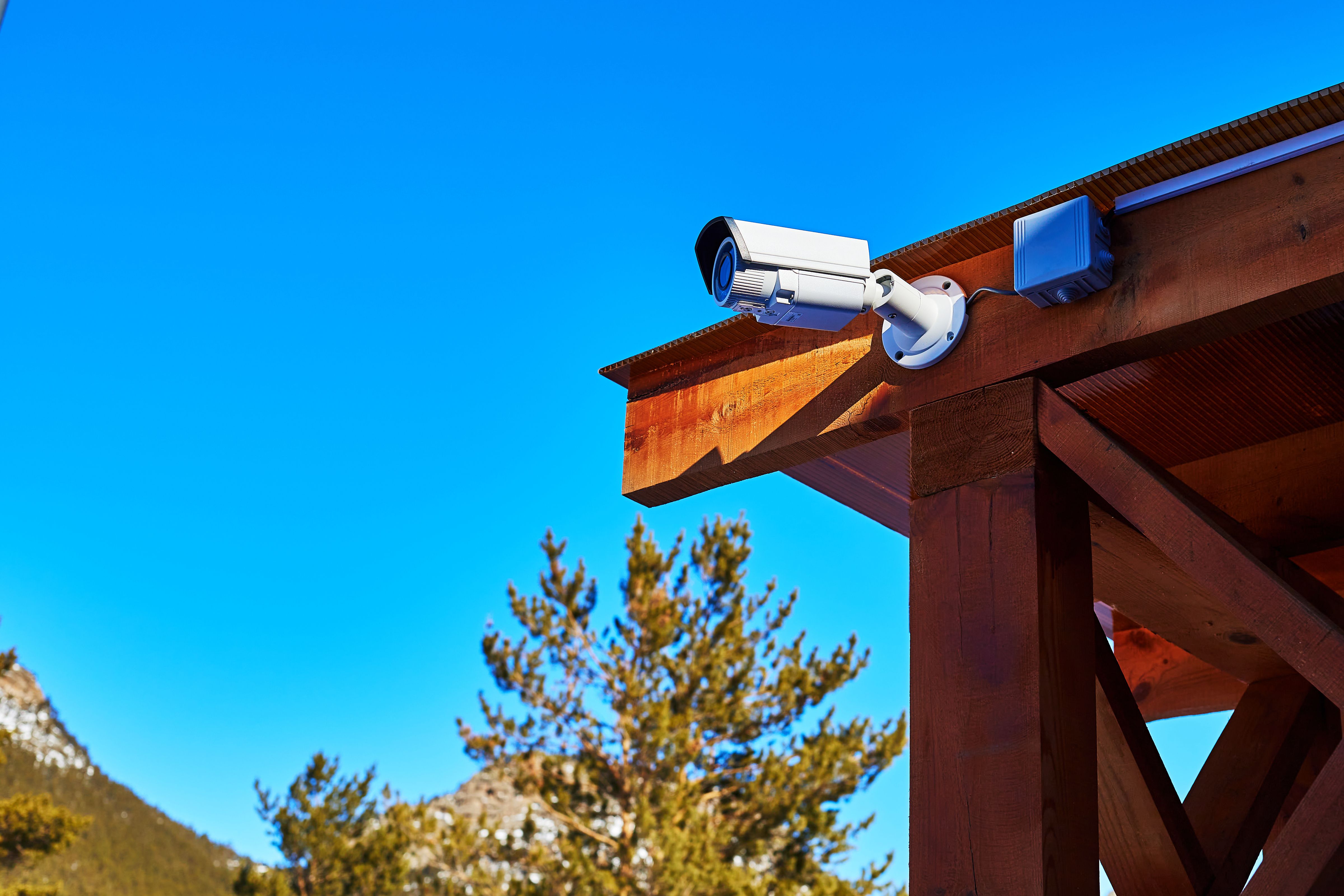 video surveillance camera mounted on a wooden canopy