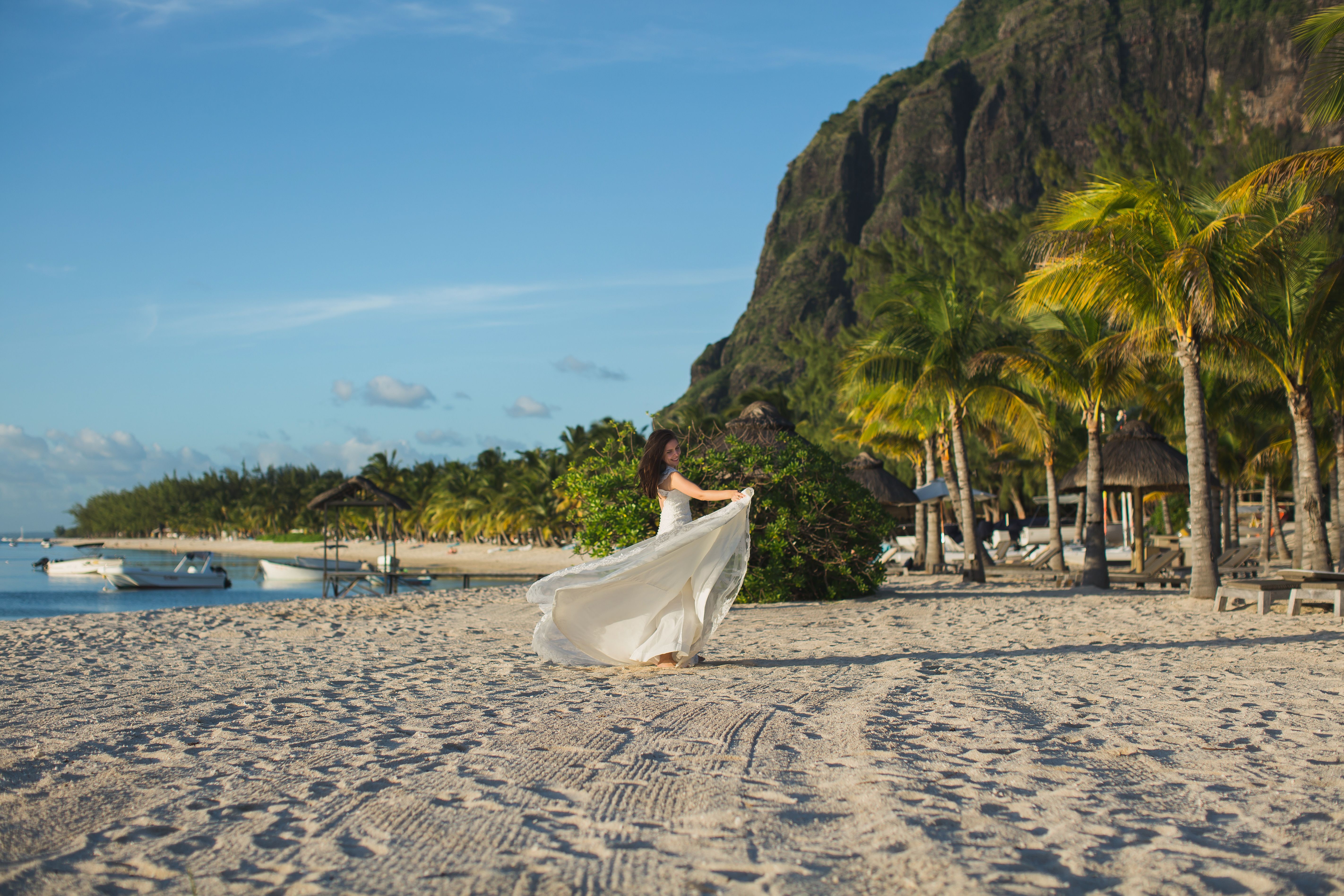 Beautiful bride in white dress on the beach in Mauritius