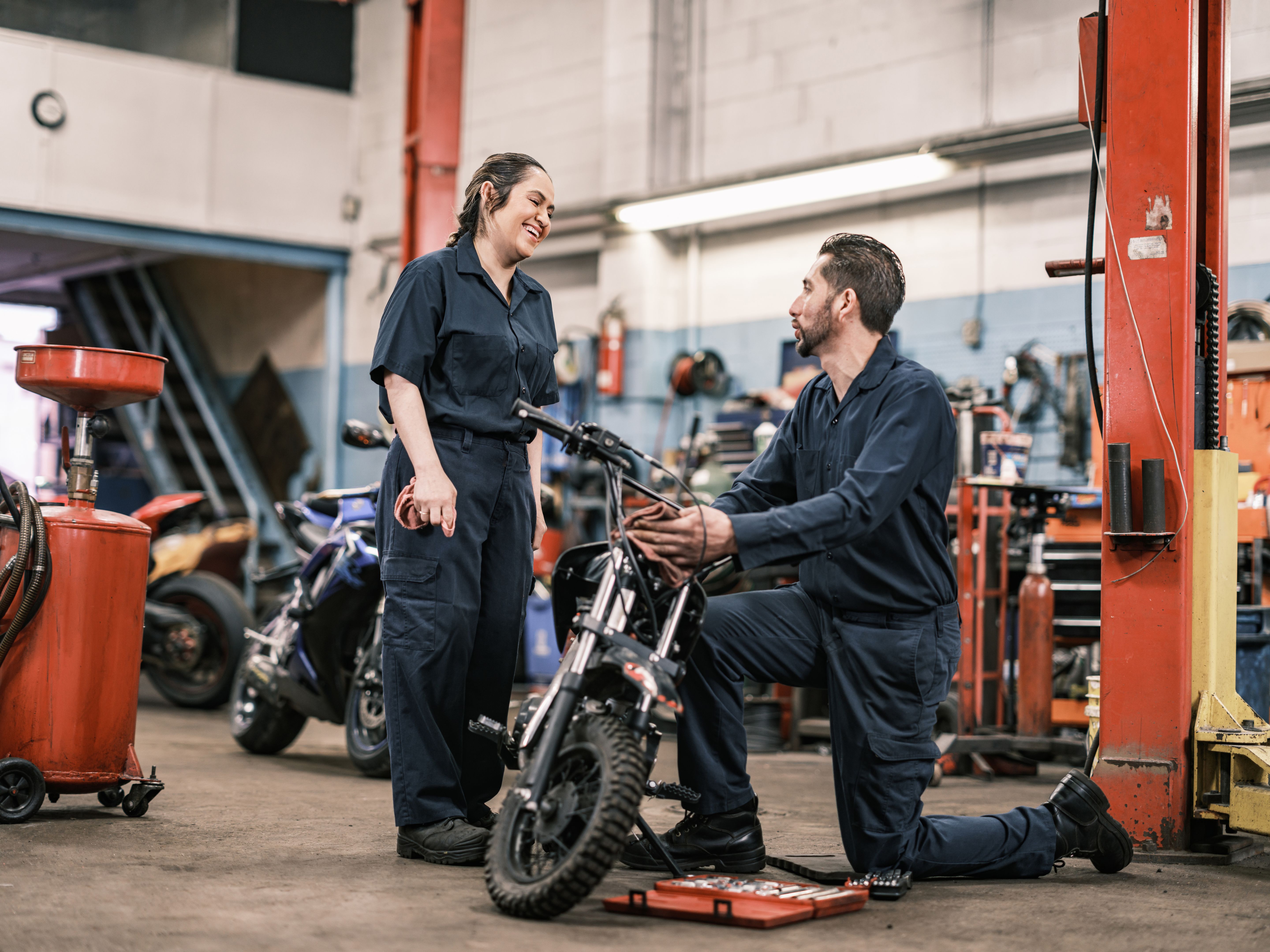 mechanic working motorcycle