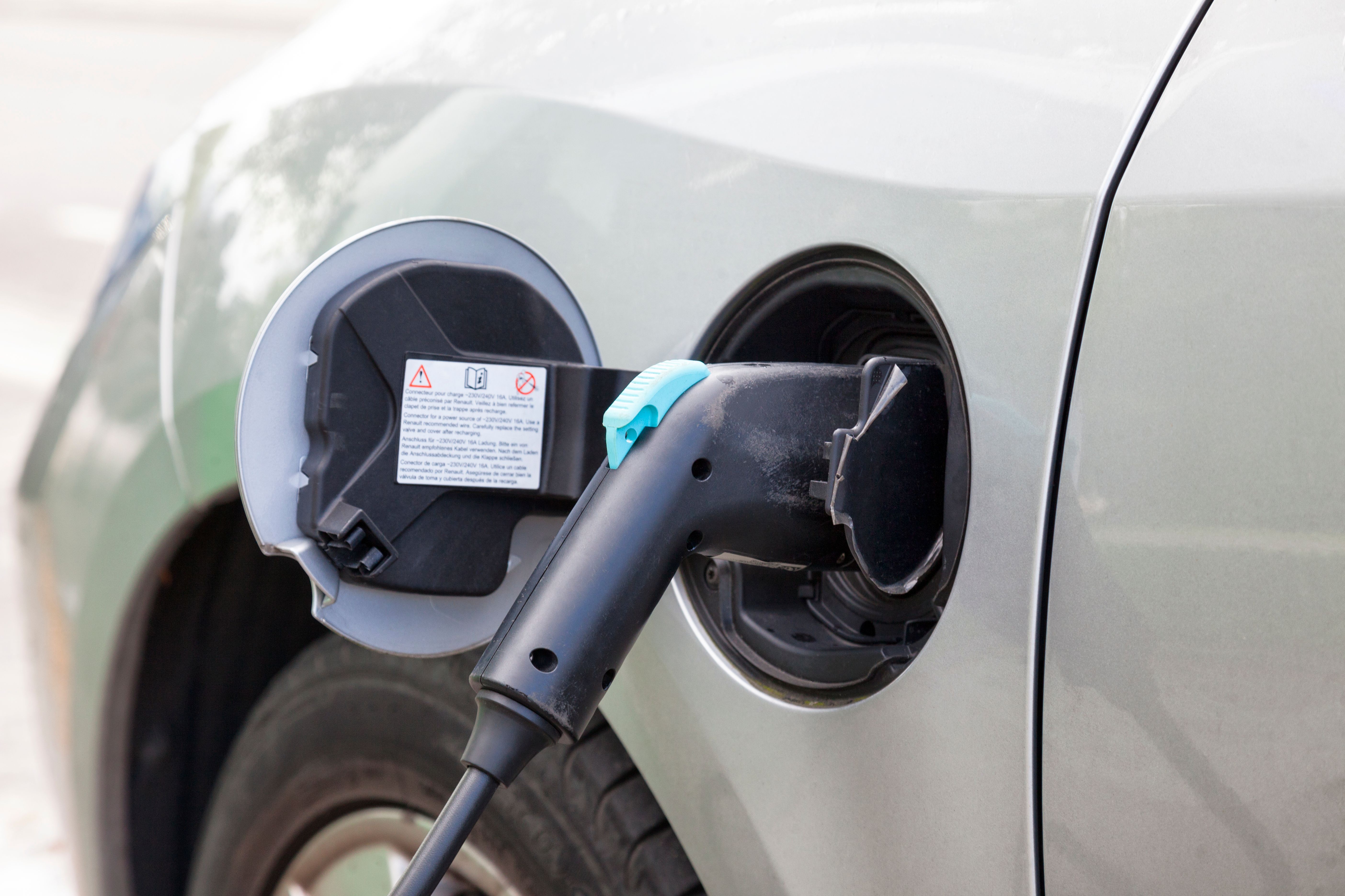 Electric car plugged in charging