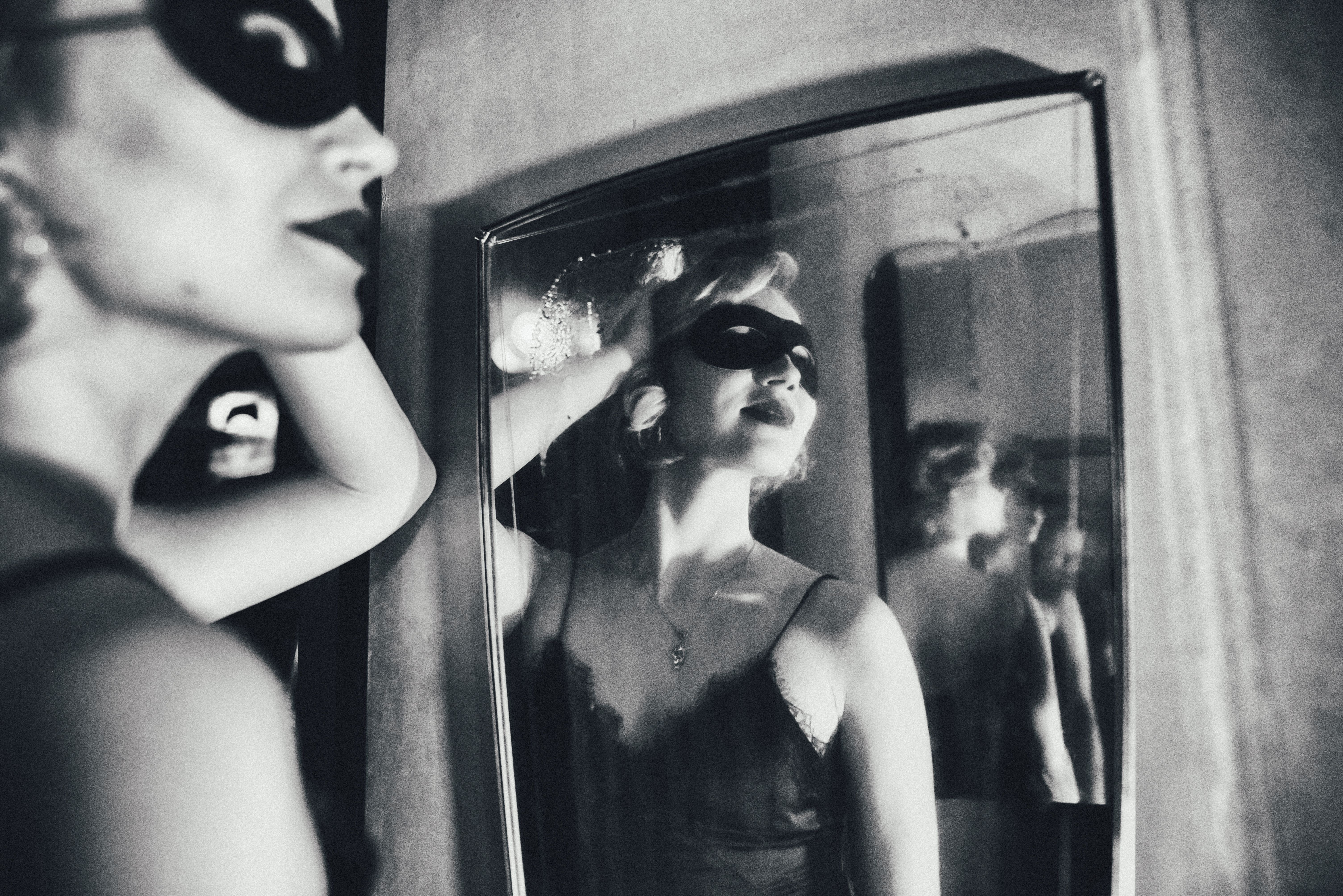 The beautiful one with the mask in the mirror