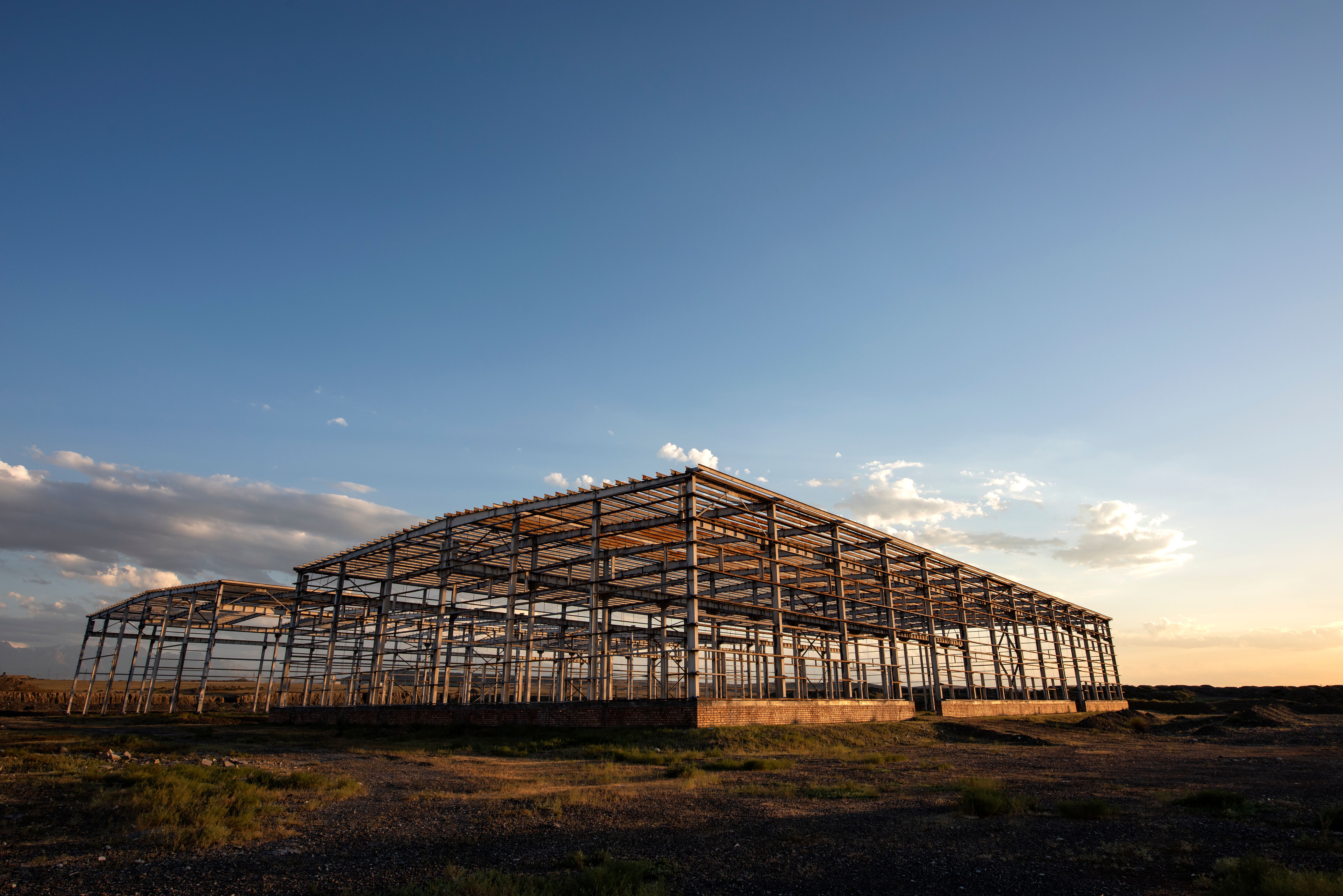 The building's steel structure is set against the dusk sky