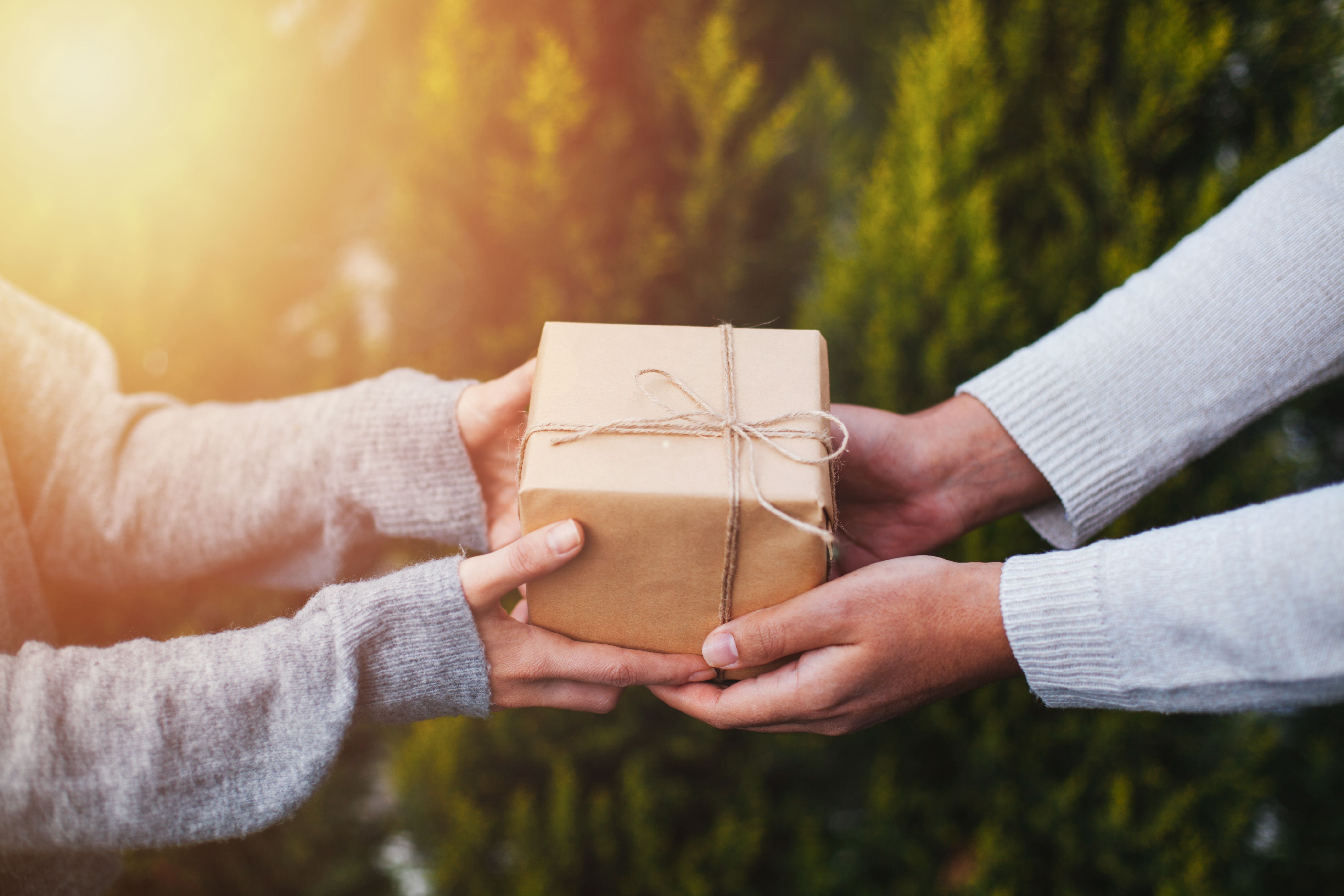Man giving present to woman