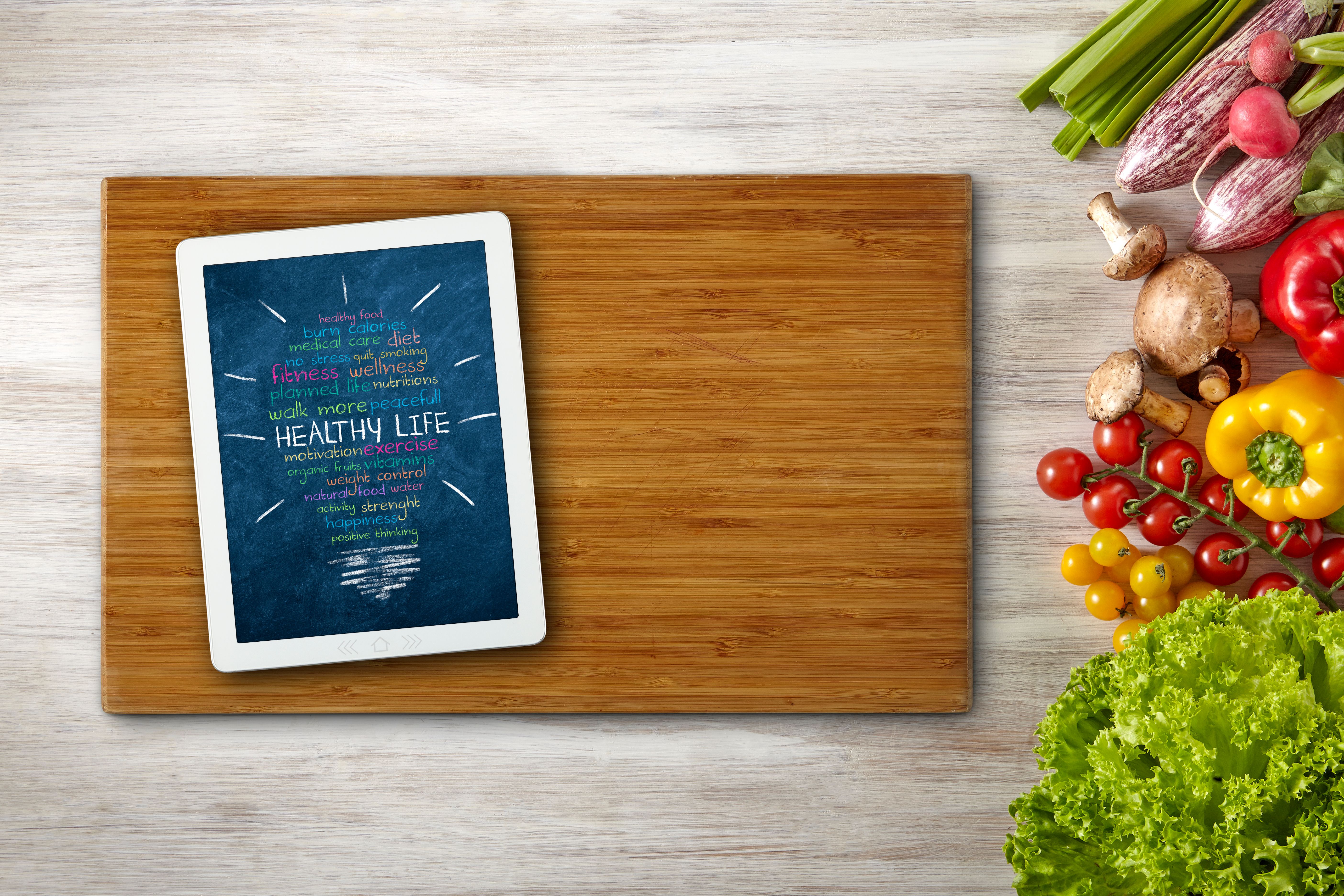 Healthy Words on Digital Tablet Screen with Vegetables Frame - Copy Space Healthy Words on Digital Tablet Screen with Vegetables Frame - Copy Space