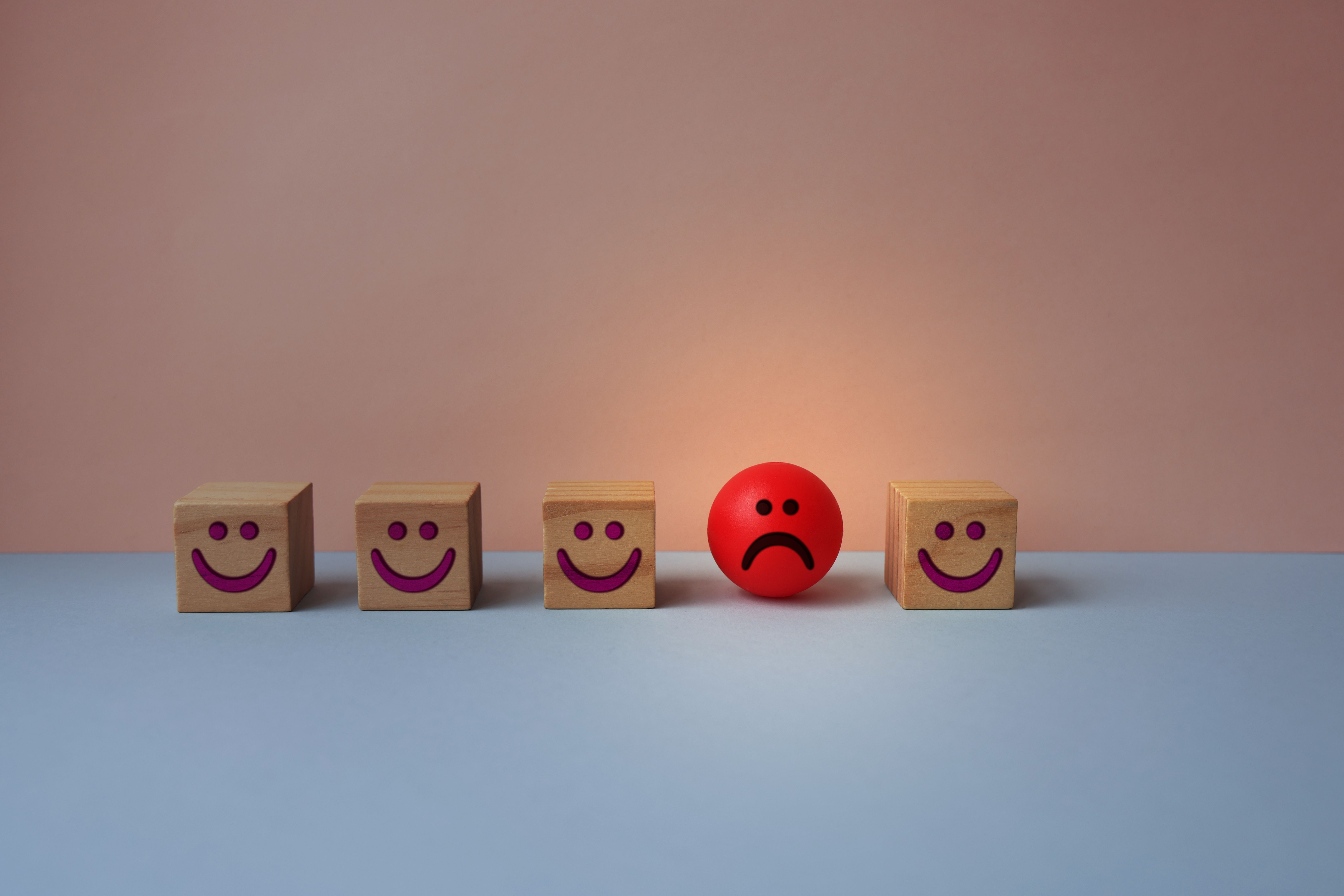 Emoticon faces concept. Standing out from the crowd.