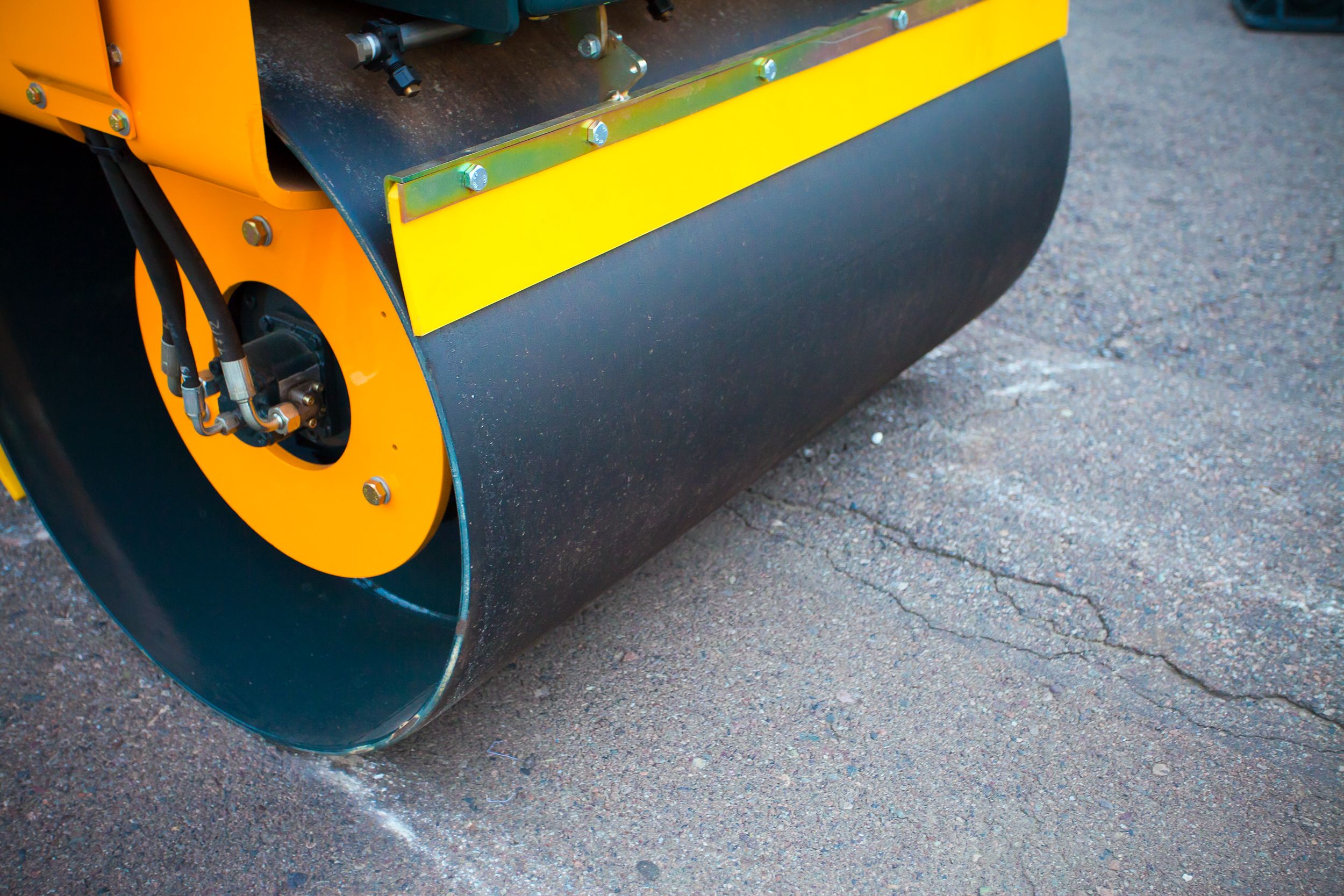 Road rollers close-up during asphalt paving works Road rollers close-up during asphalt paving works