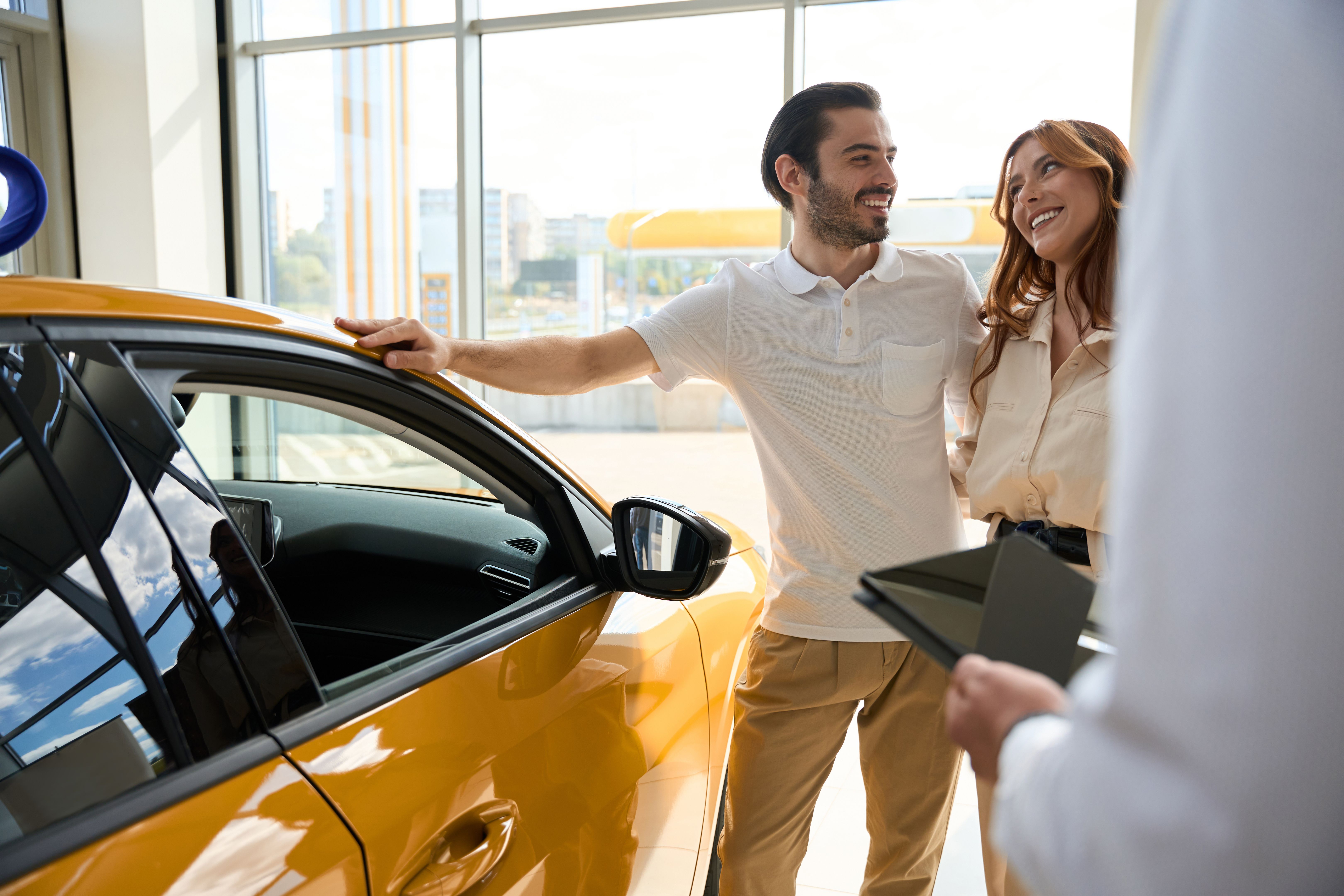 Loving man gifting new motorcar to young woman