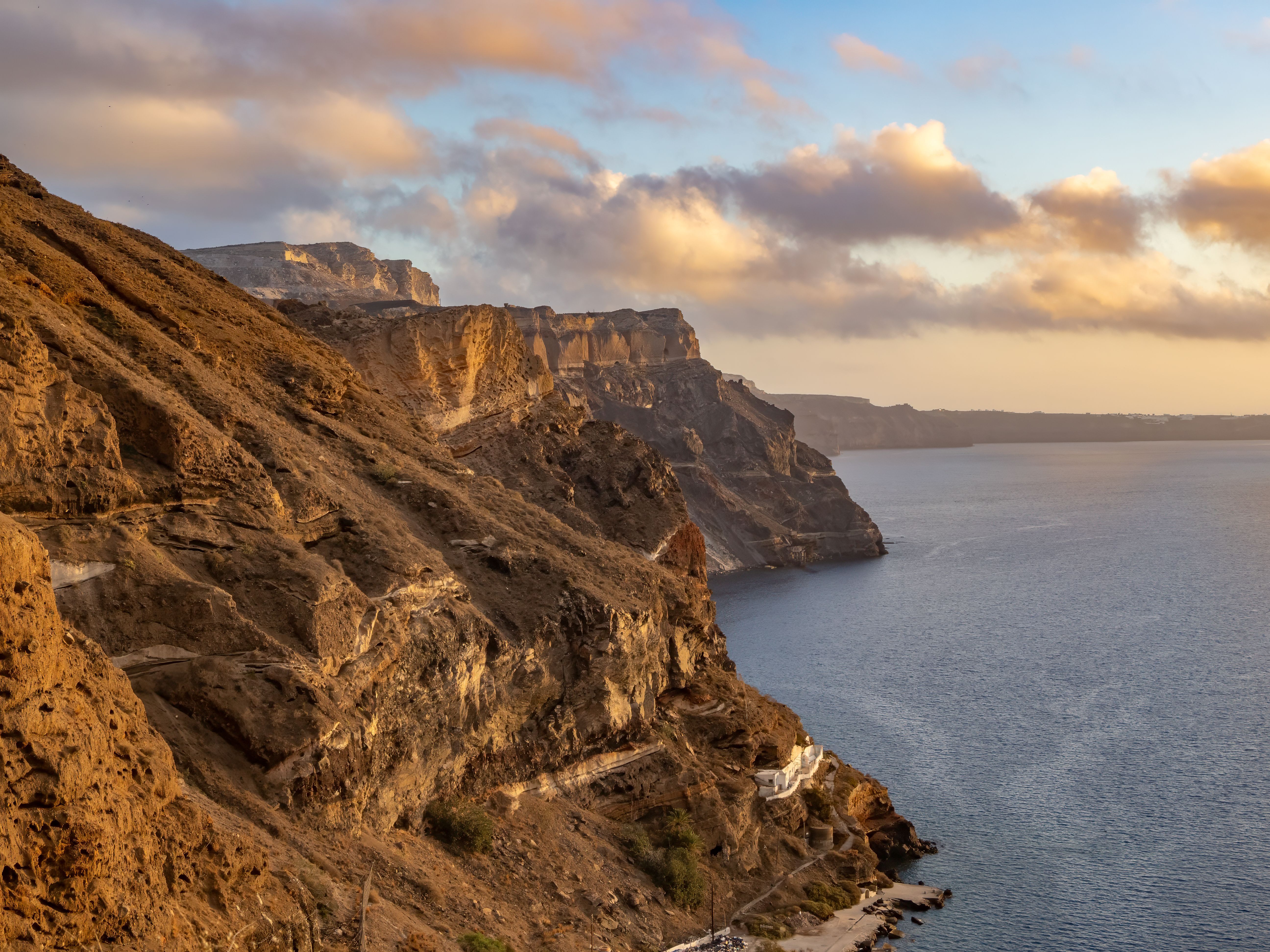 Sunset over Santorini (officially Thira and Classical Greek Thera) island, Cyclades islands, Aegean Sea, Greece
