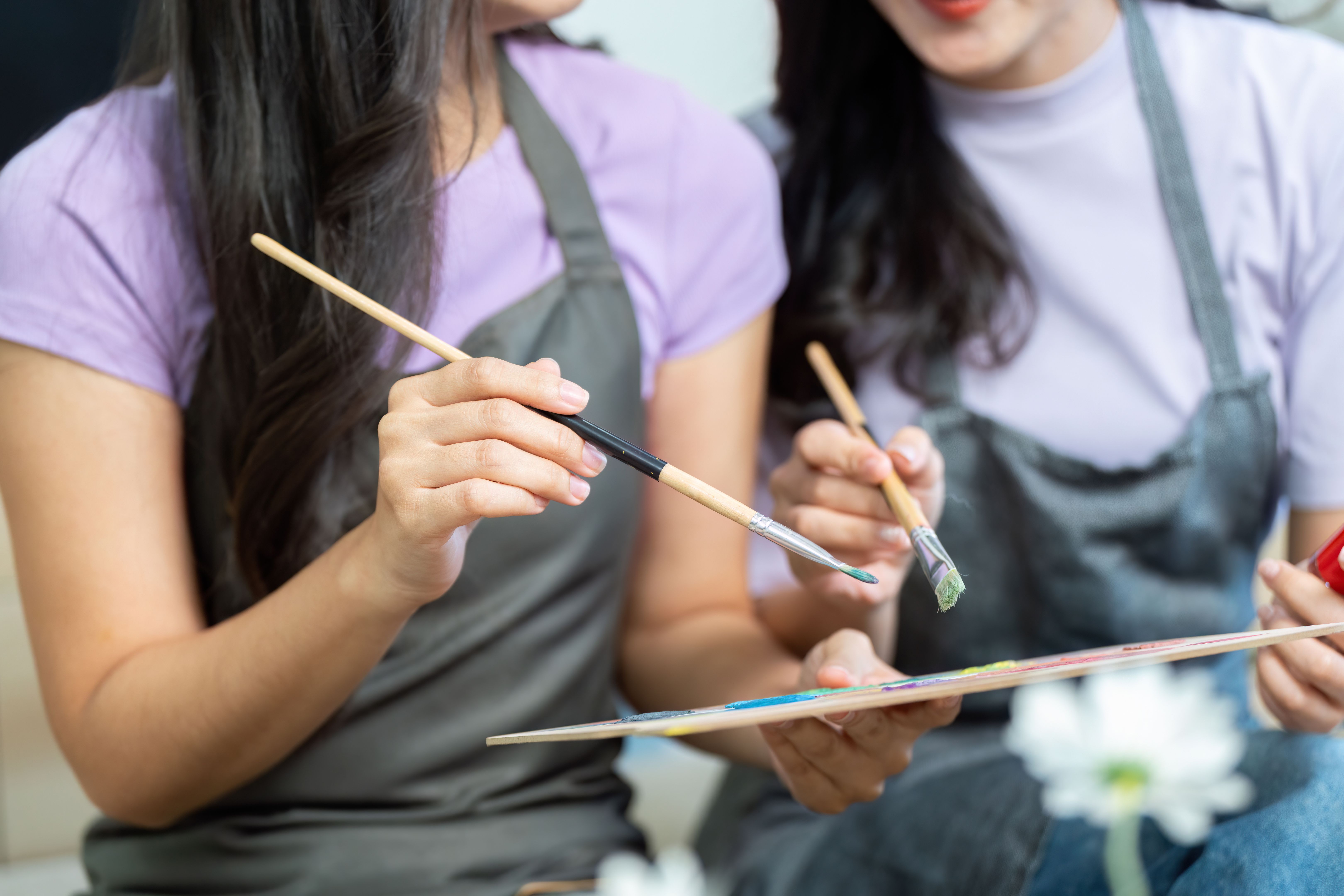 LGBTQ couple enjoying art session together, creating beautiful memories LGBTQ couple enjoying art session together, creating beautiful memories