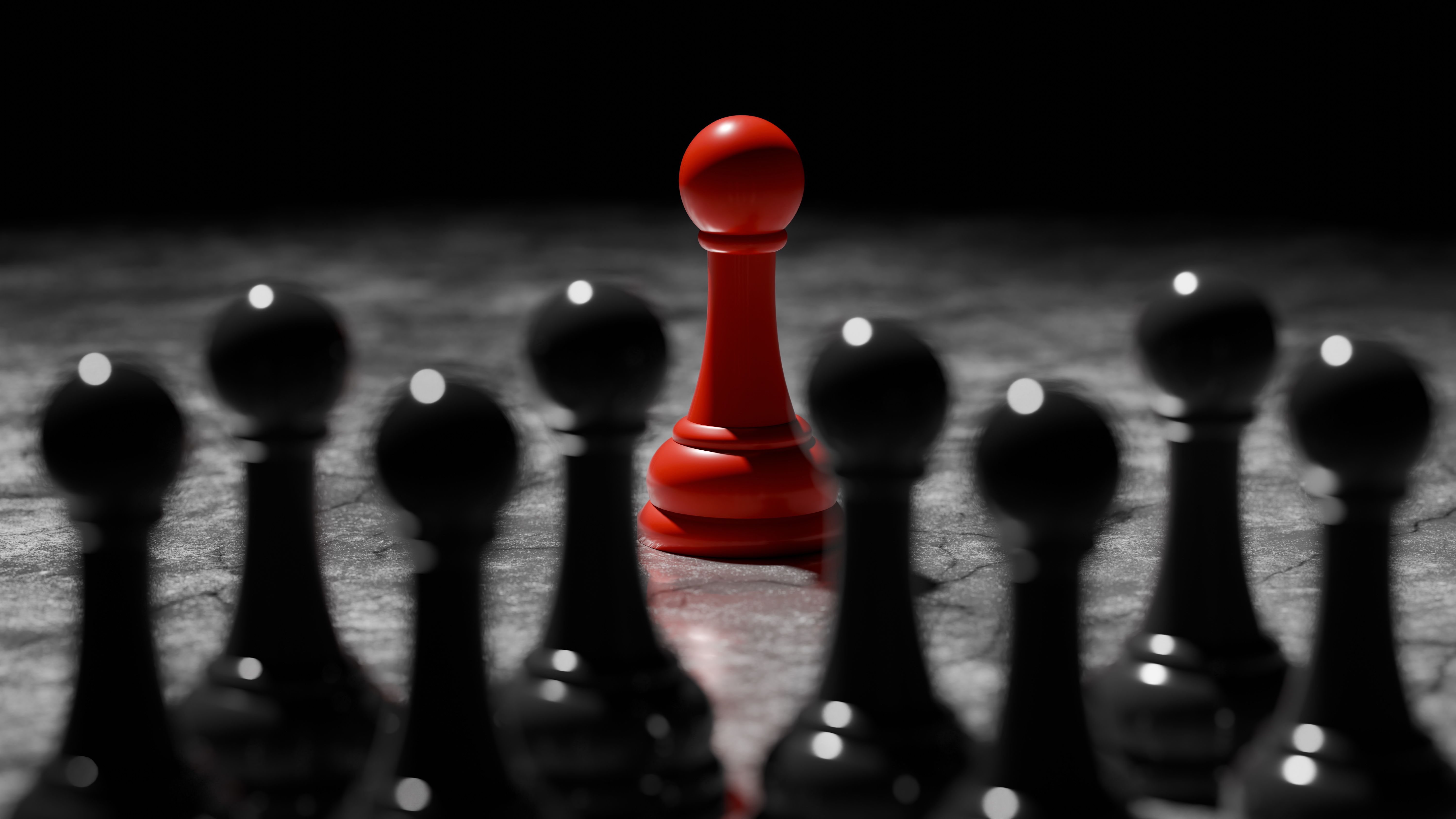 single red pawn prominently displays its color while surrounded by black chess pieces on a dark surface, creating a striking contrast during an evening game focused on strategy. 3d render single red pawn prominently displays its color while surrounded by black chess pieces on a dark surface, creating a striking contrast during an evening game focused on strategy. 3d render
