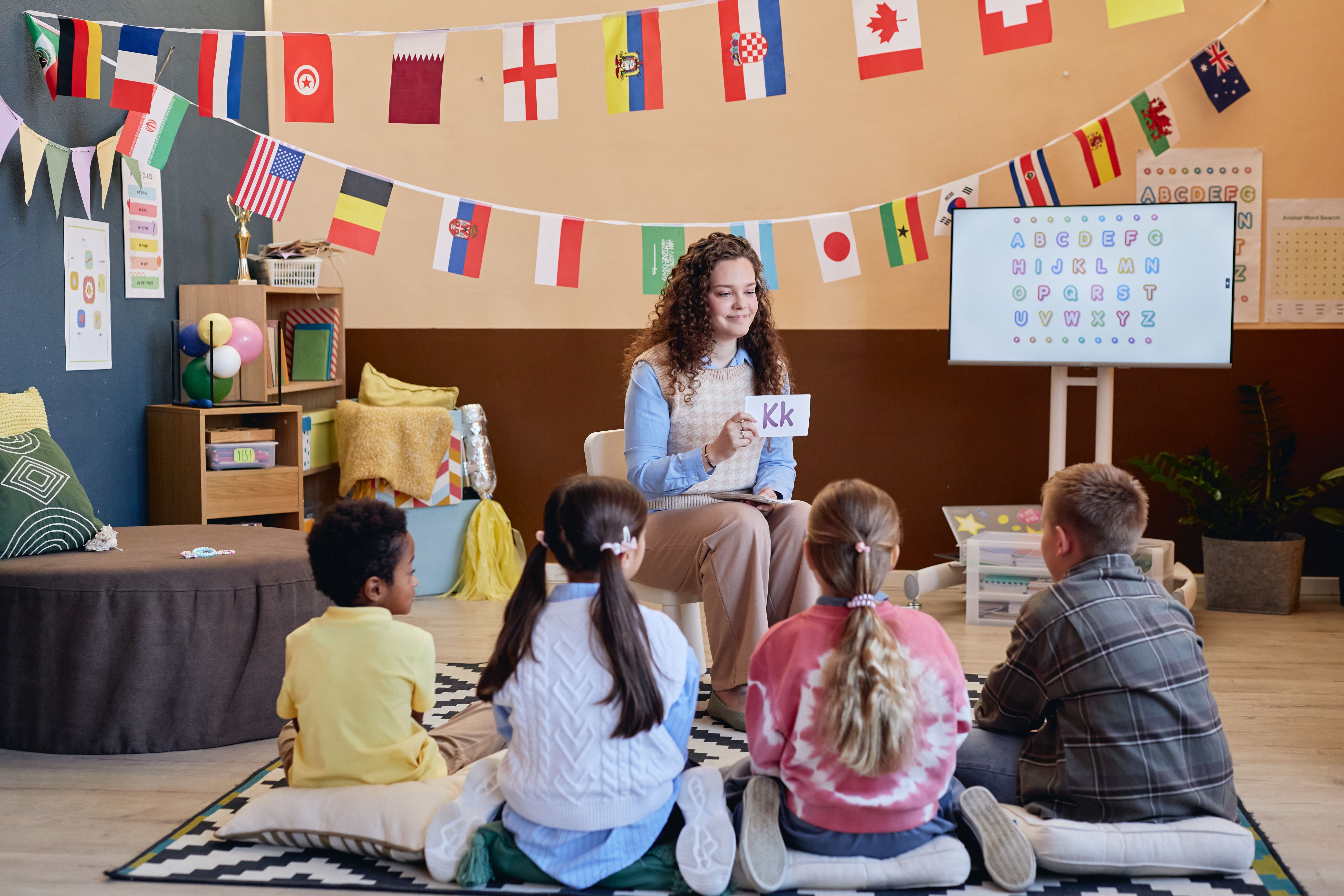 Scene of Woman Teaching Kids Letters Alphabet in School