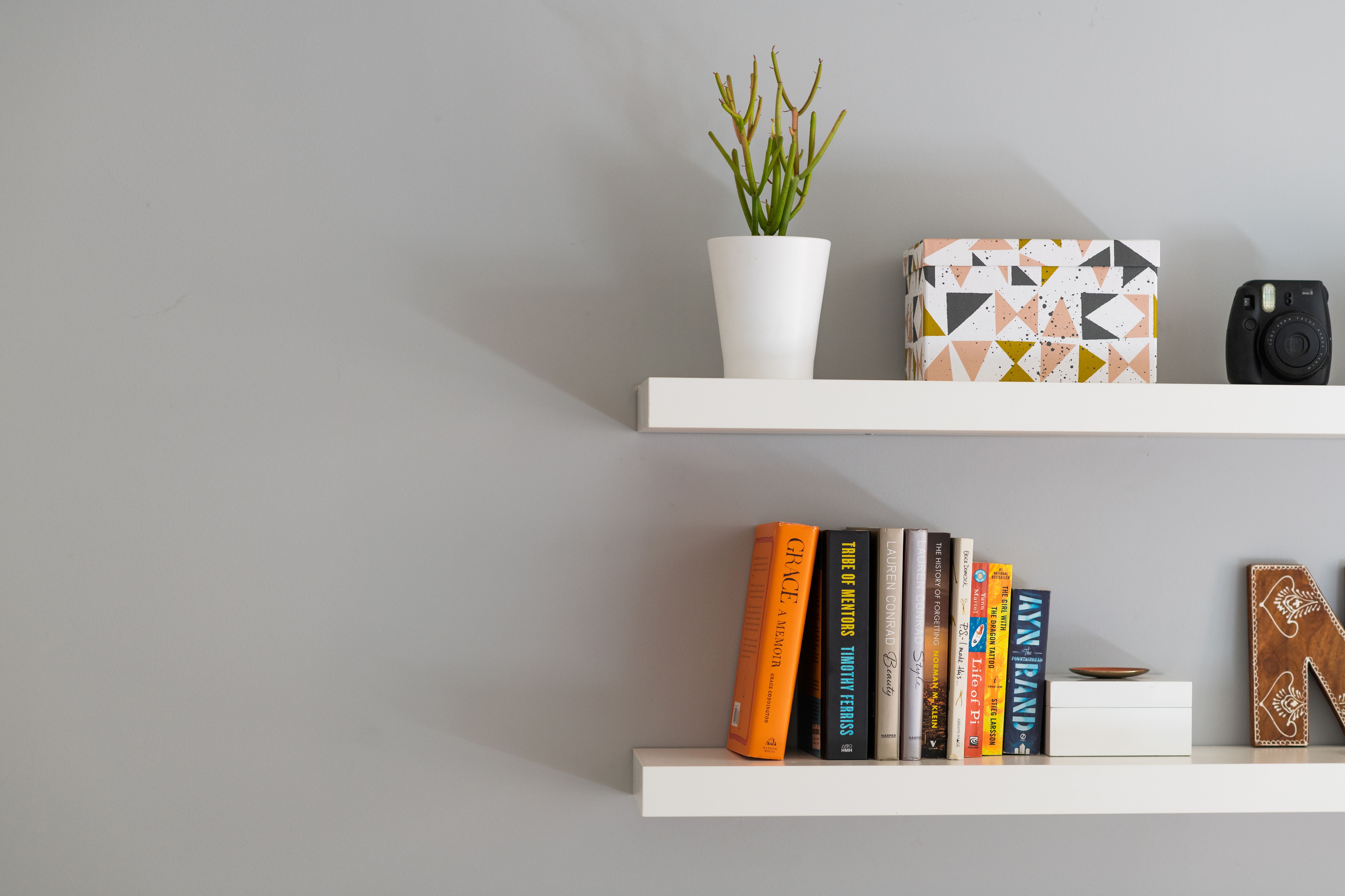 Modern Floating Bookshelves with Books, a Plant and Decorative Box Modern Floating Bookshelves with Books, a Plant and Decorative Box