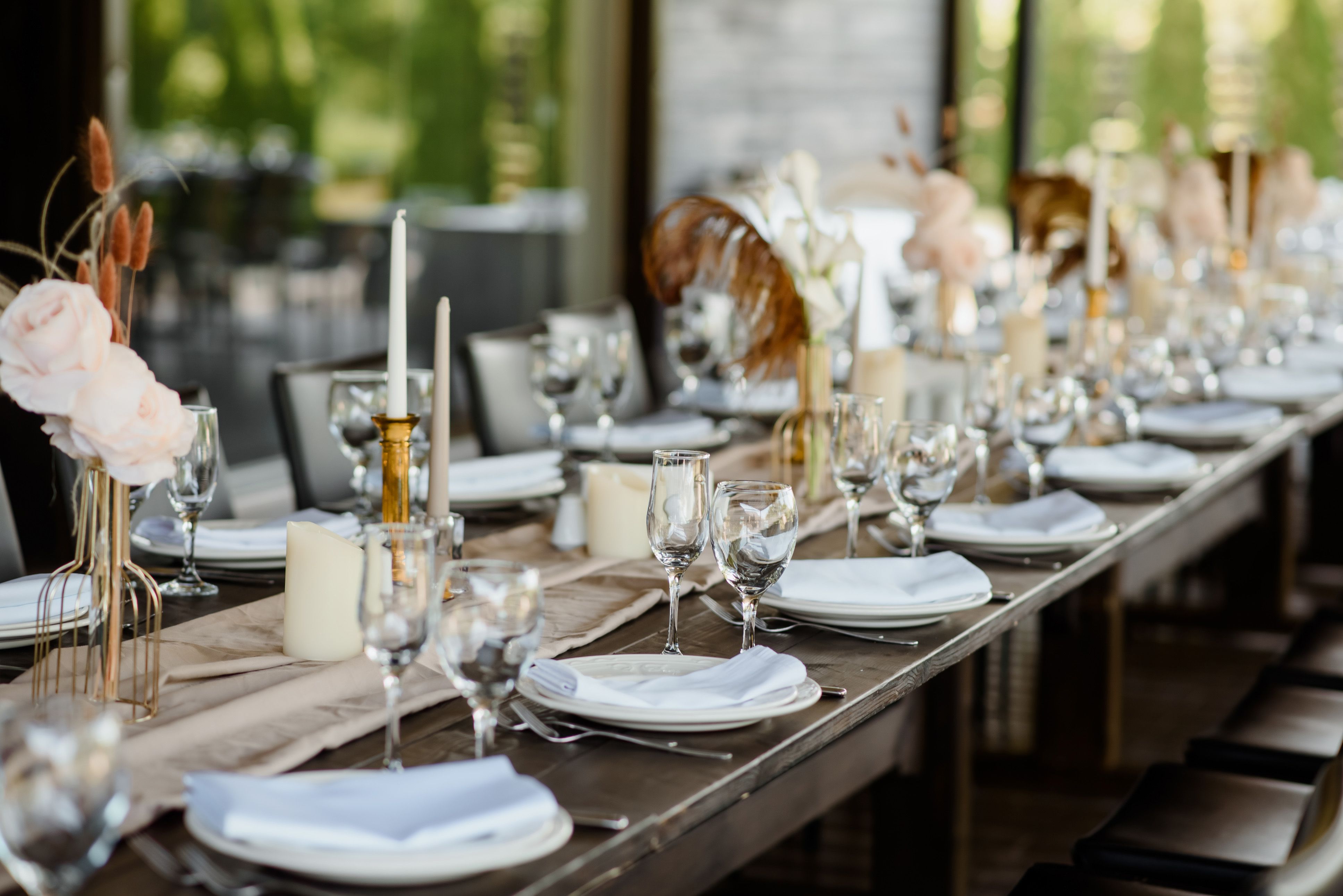Arranged table with plates and glasses on a wedding reception
