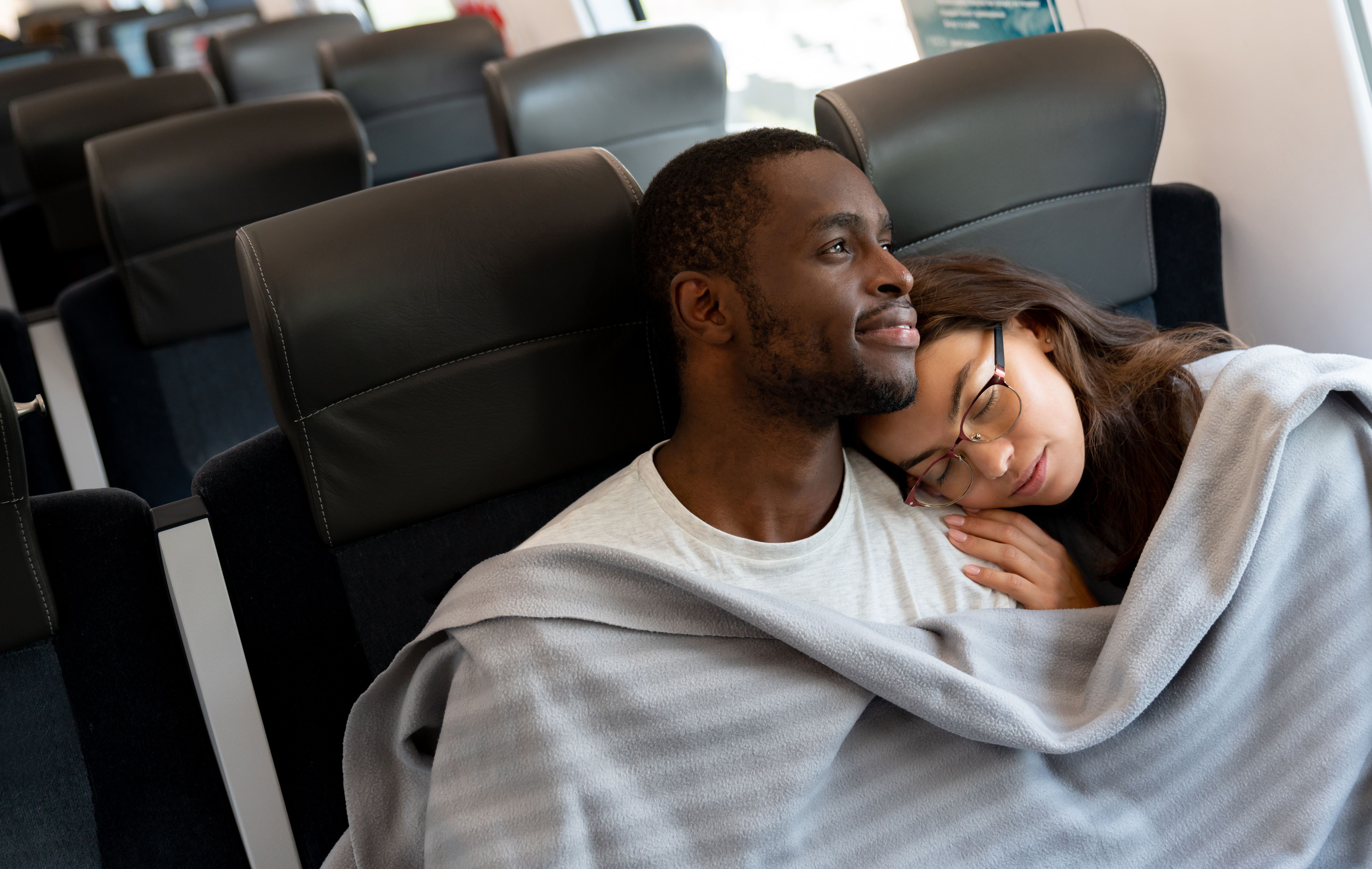 Loving couple traveling by train Loving couple traveling by train