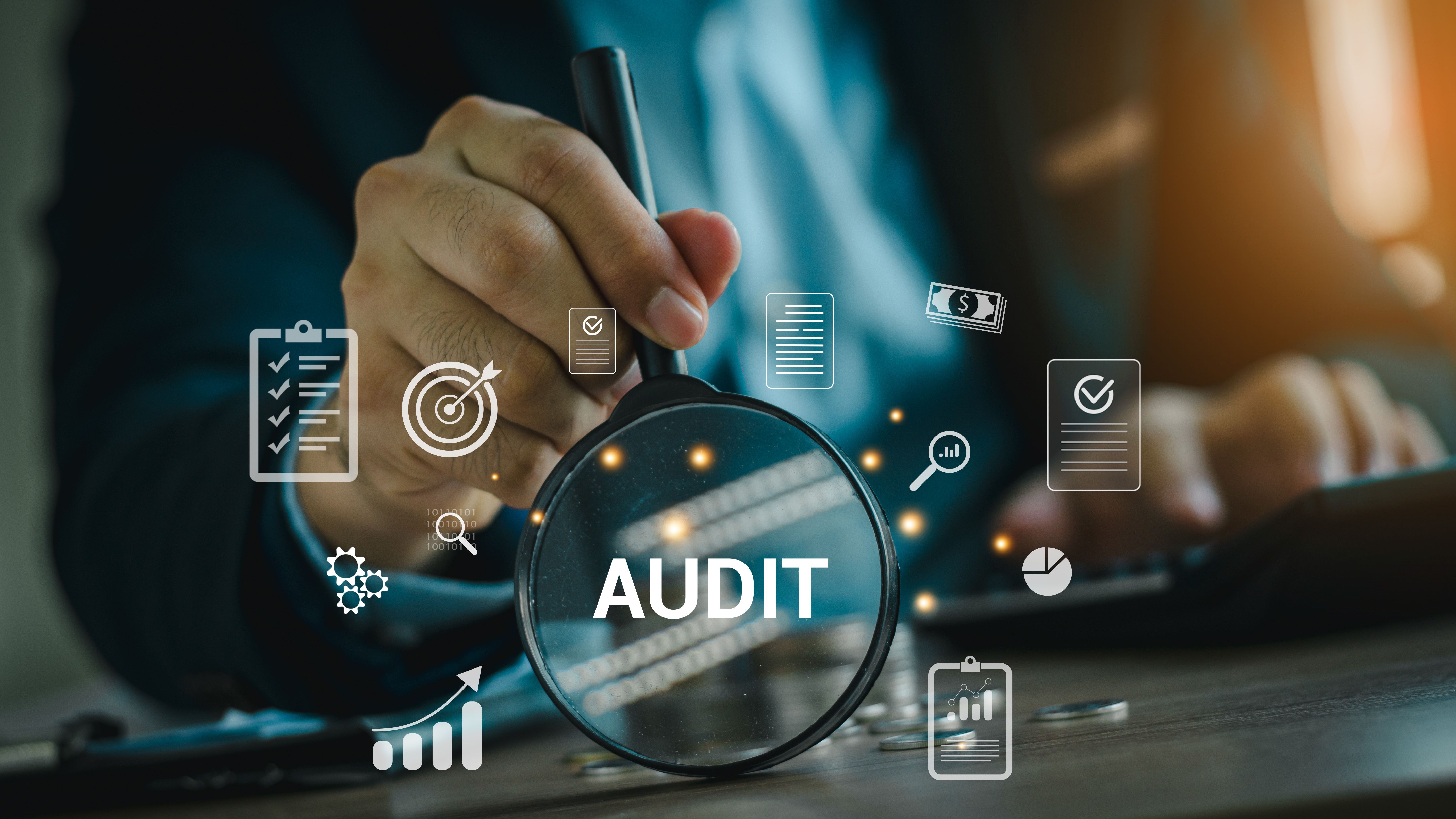 Audit business concept. Businessmen Using Magnifying Glass to check and evaluate financial statements. Auditing financial accounts within the organization. Audit And Fraud Investigation. Audit business concept. Businessmen Using Magnifying Glass to check and evaluate financial statements. Auditing financial accounts within the organization. Audit And Fraud Investigation.