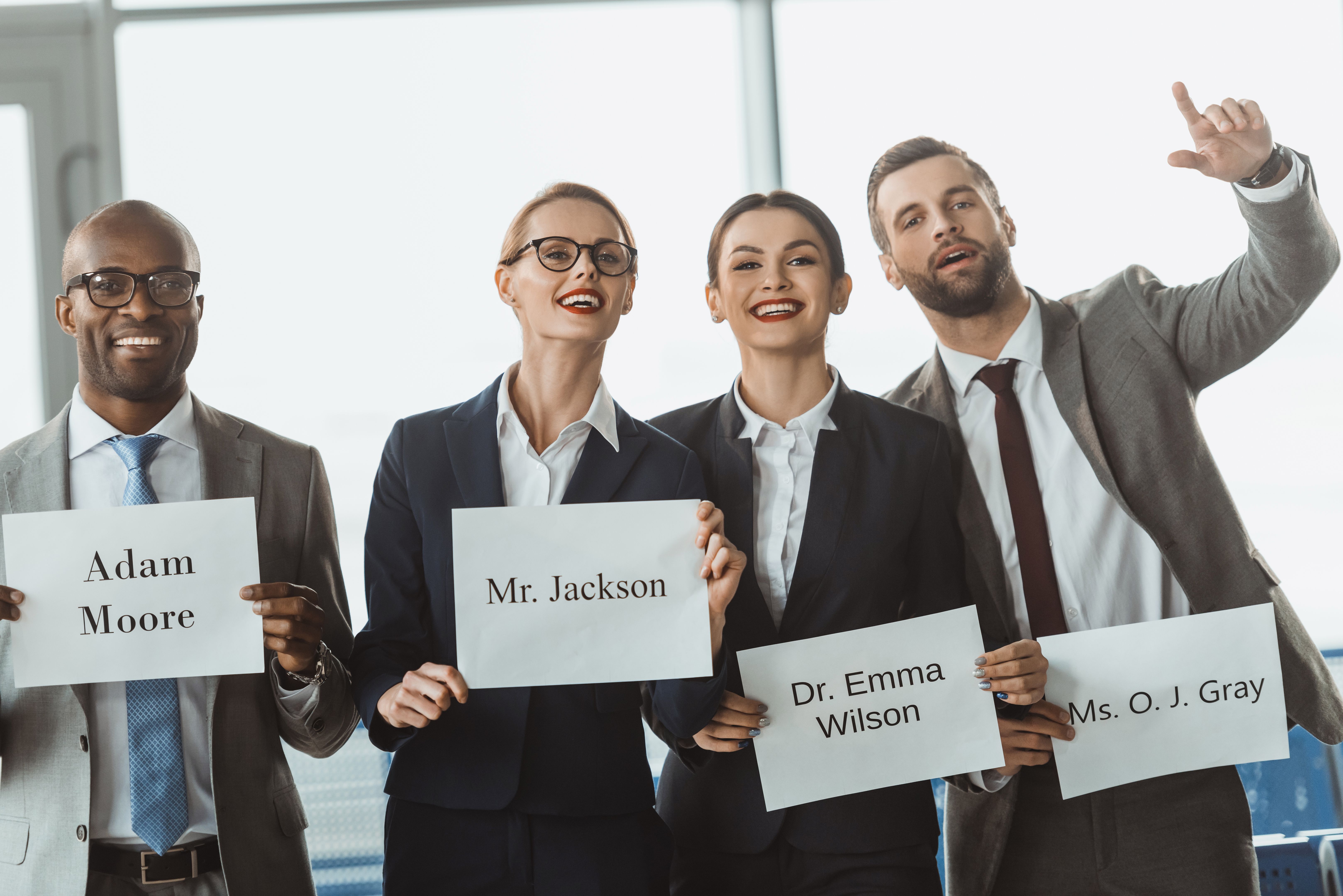 group of businesspeople waiting for partners at departure zone of airport