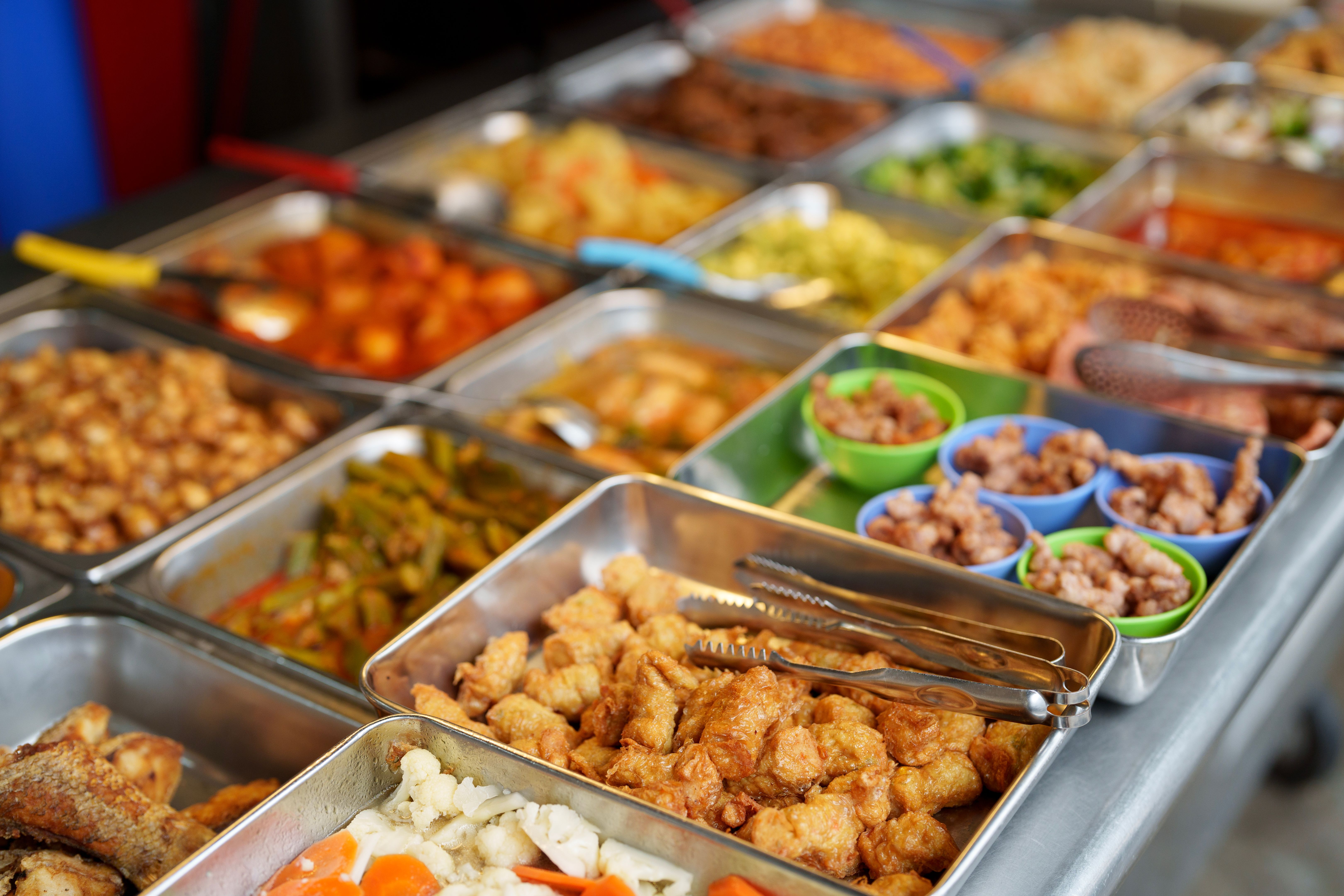 Various choice of food for picking at market stall, known as economy rice in Malaysia