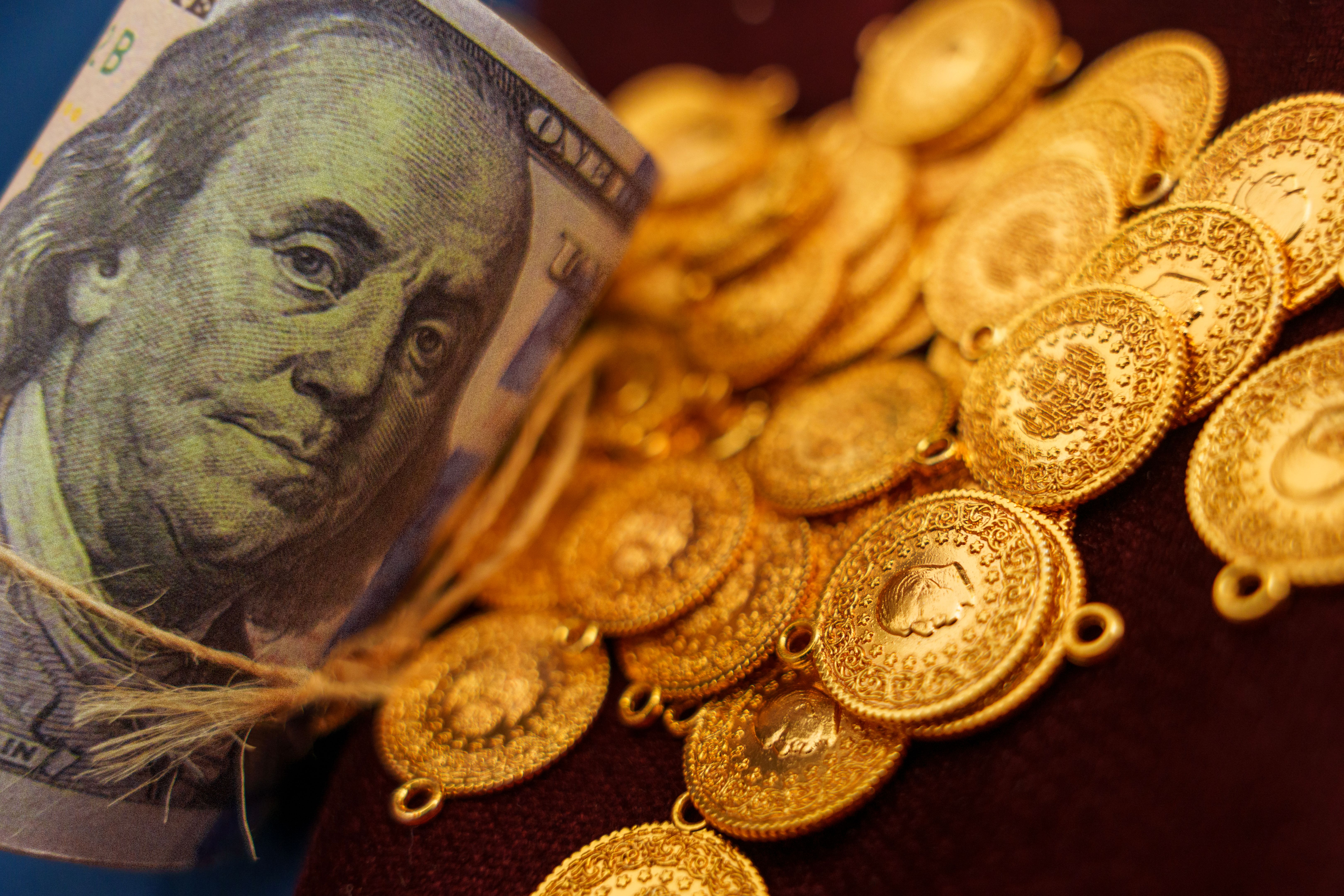 Turkish gold coins and rolls in the form of American currency dollars