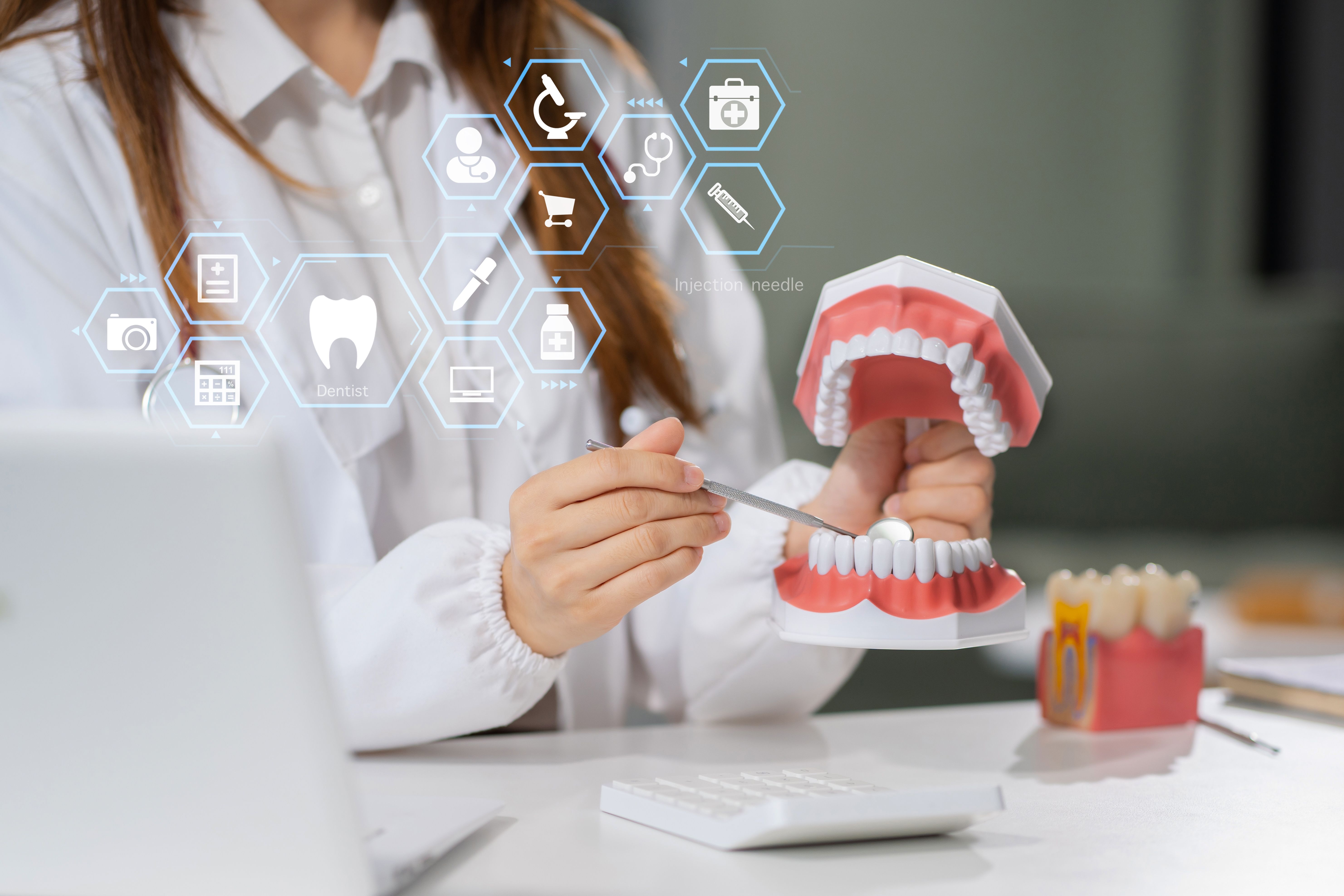 dentists writes reports of working with tooth models and analyzing dental treatments.