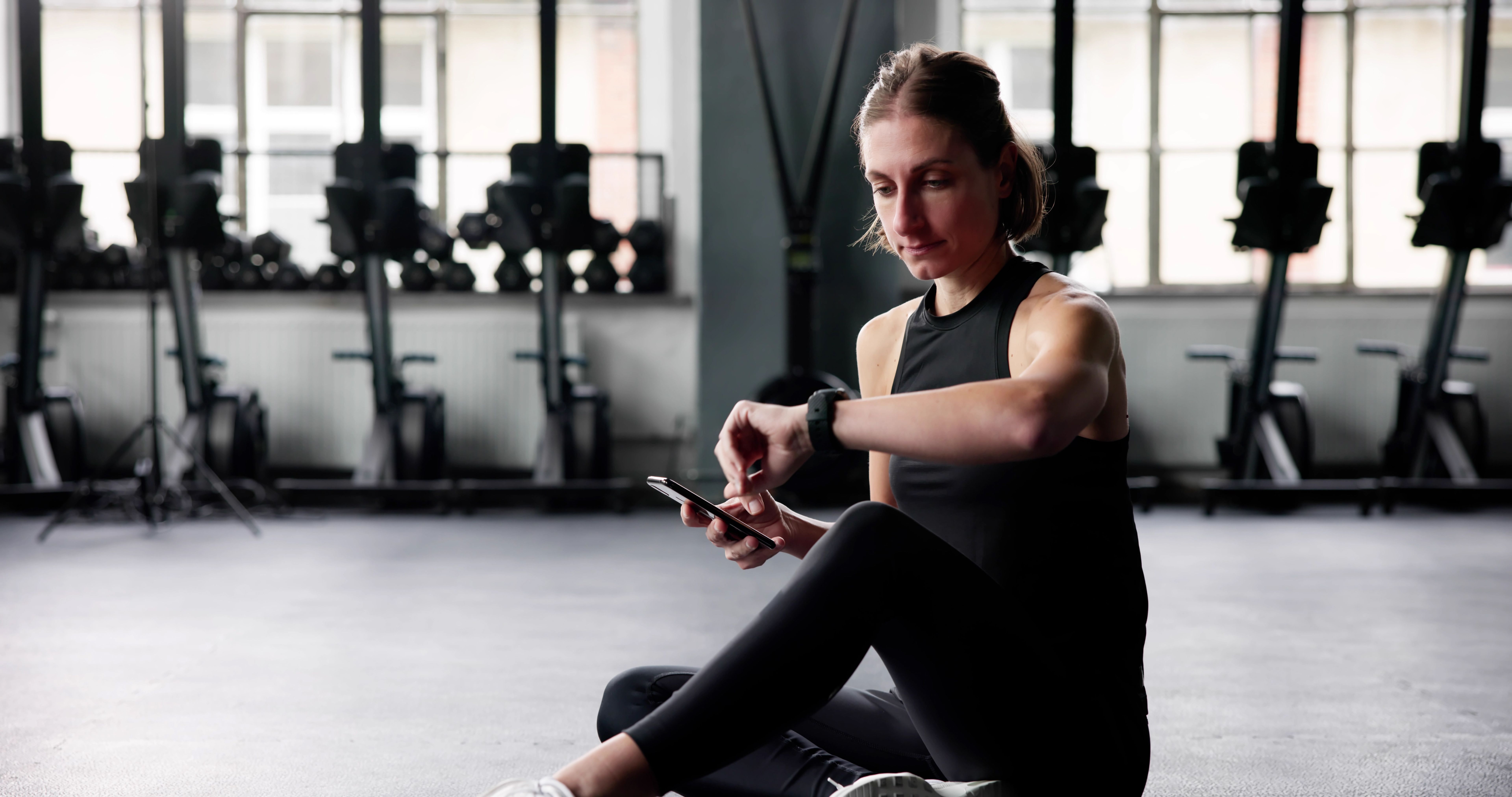 Athlete Woman Checking Smart watch