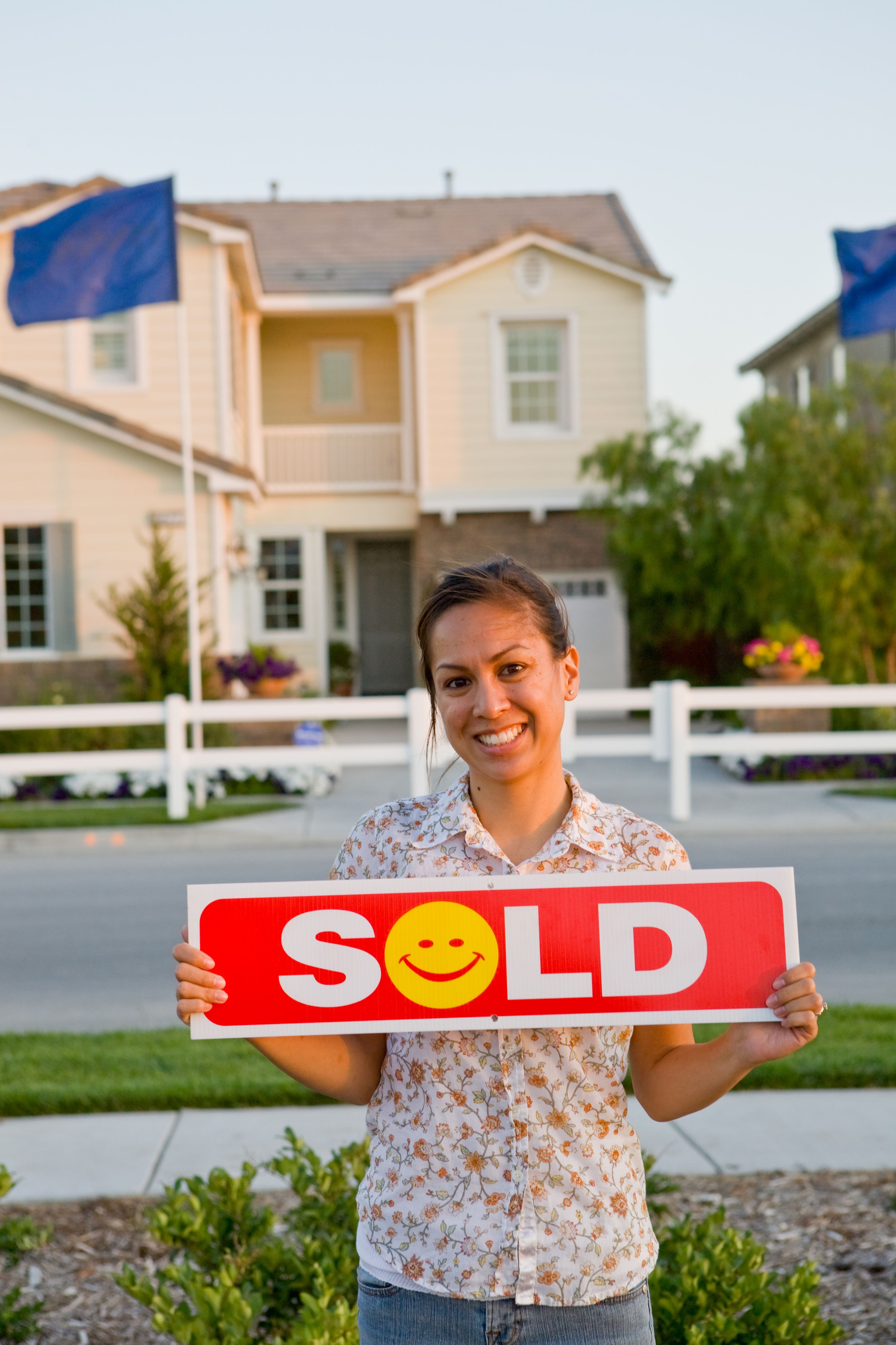 Pretty Girl Holding sold Sign (close-up) Pretty Girl Holding sold Sign (close-up)