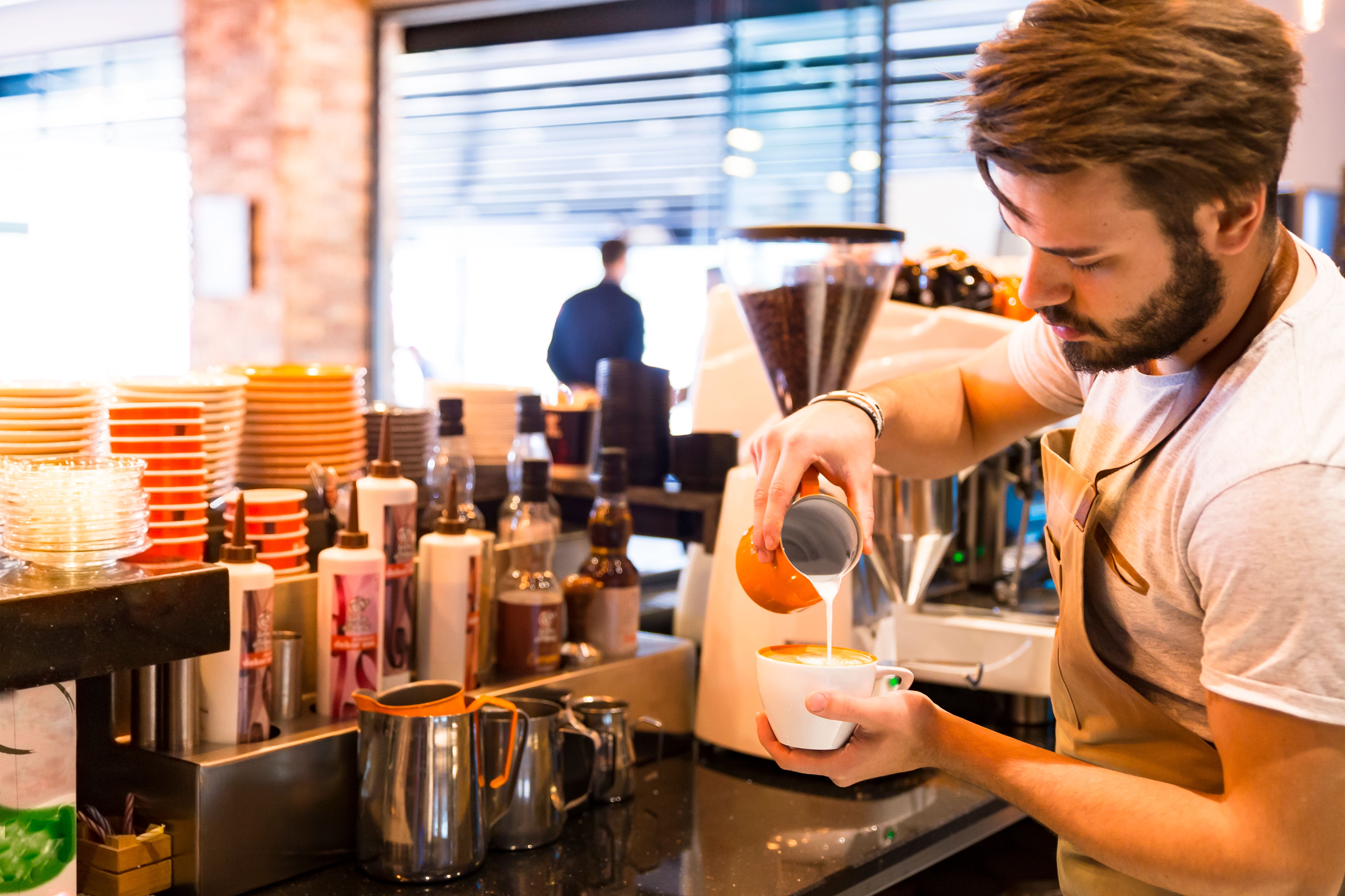 barista making coffee