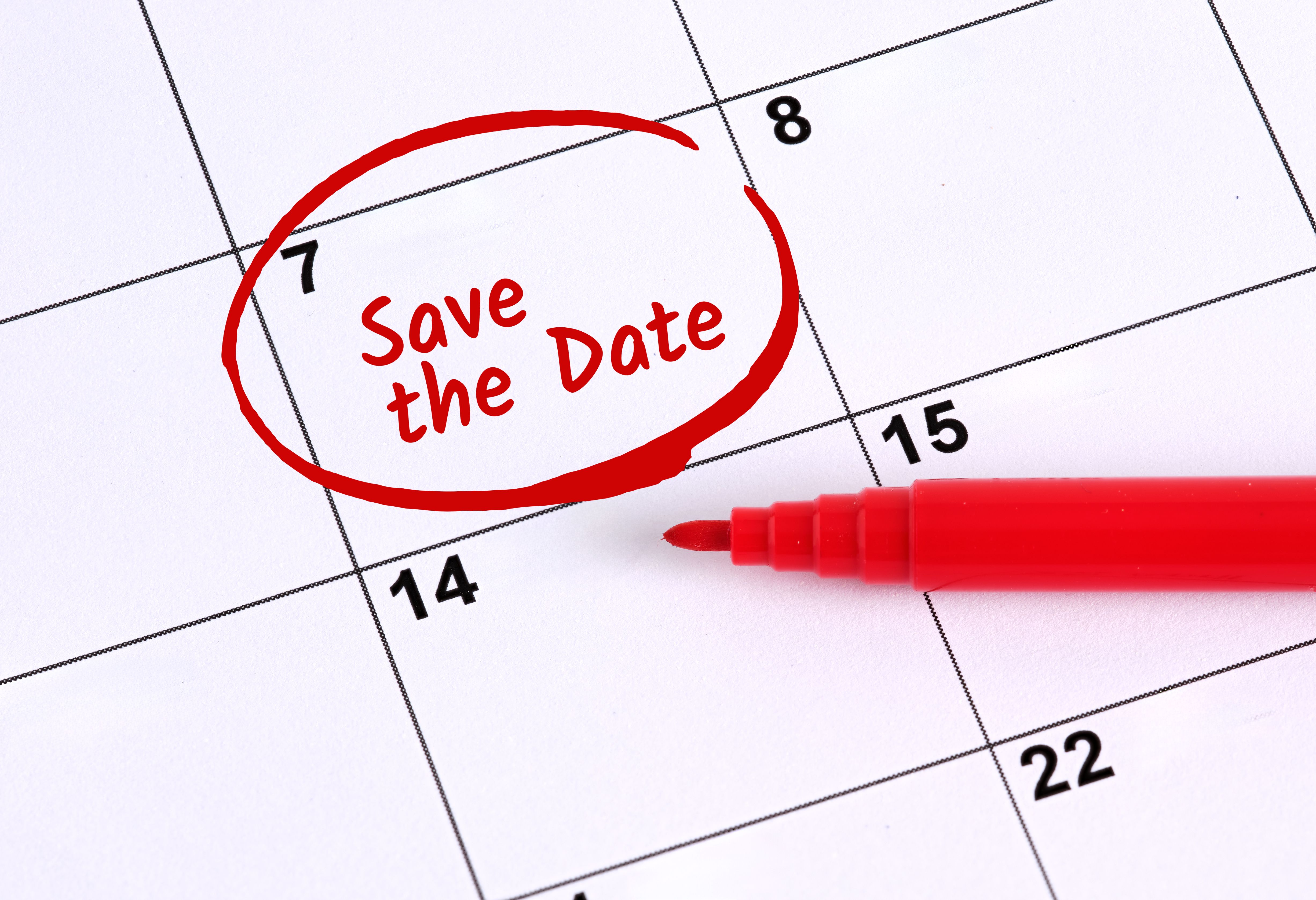 Red marker highlighting save the date reminder on calendar