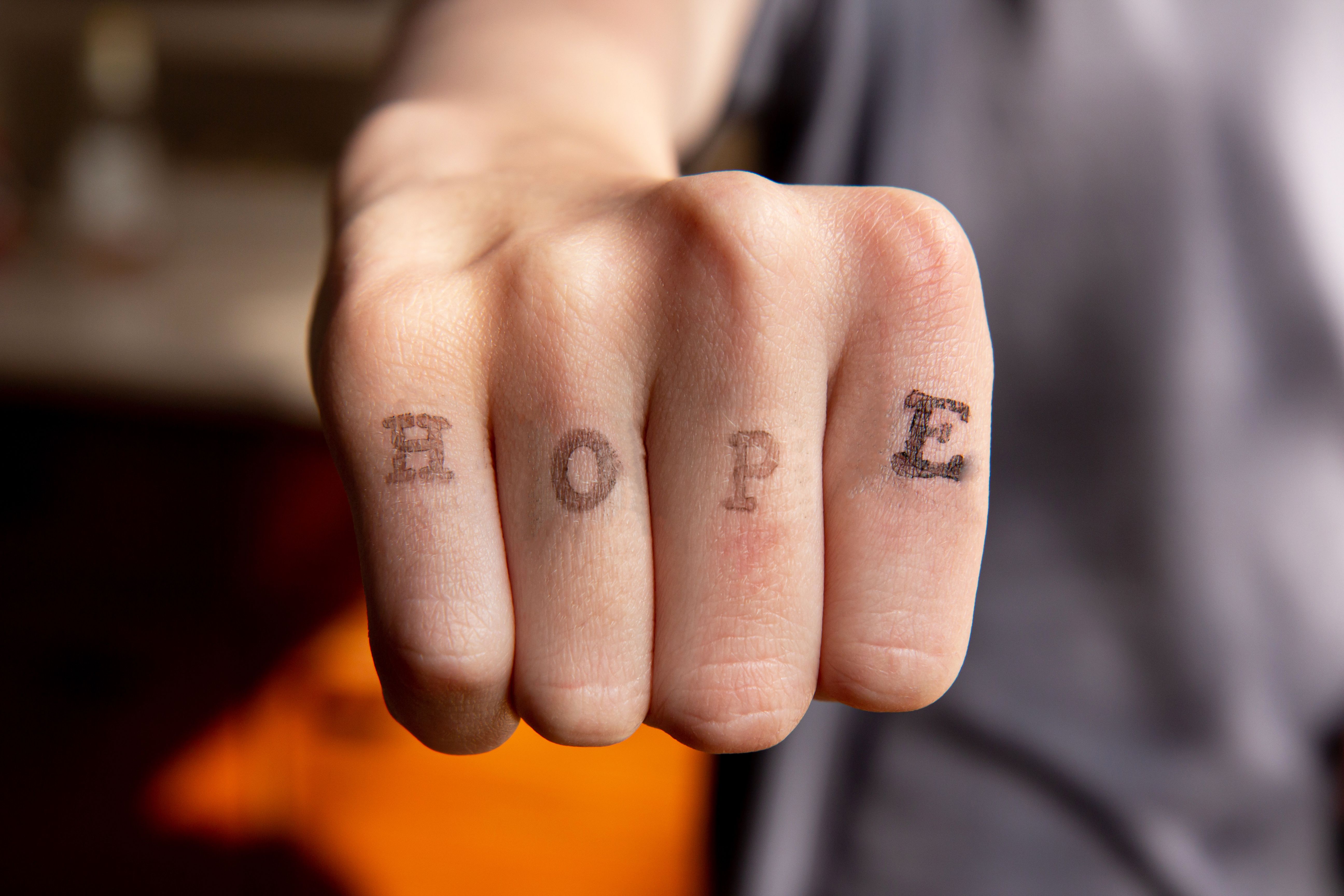 Hand lettering Hope on blurred background Hand lettering Hope on blurred background