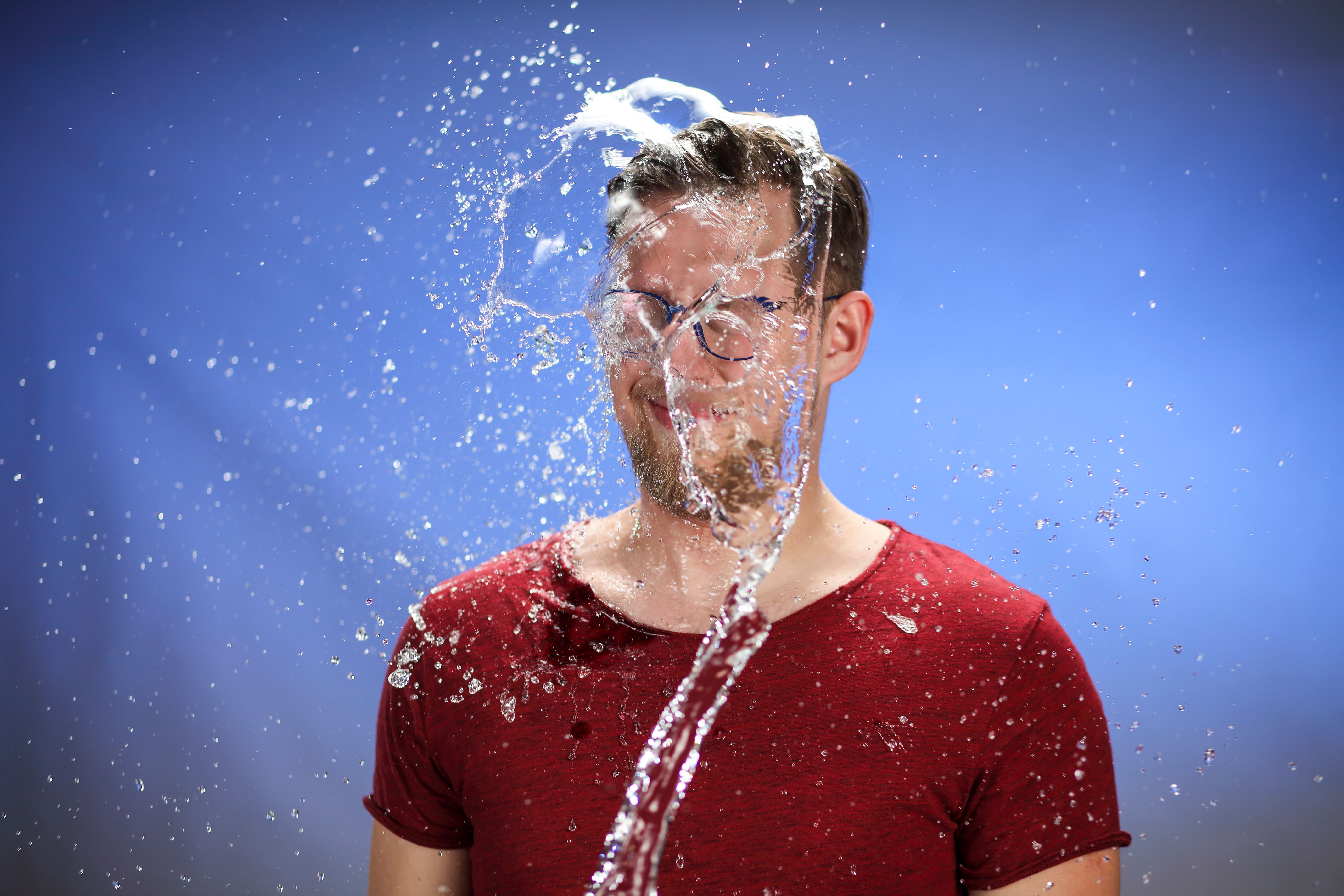 Man being splashed with water