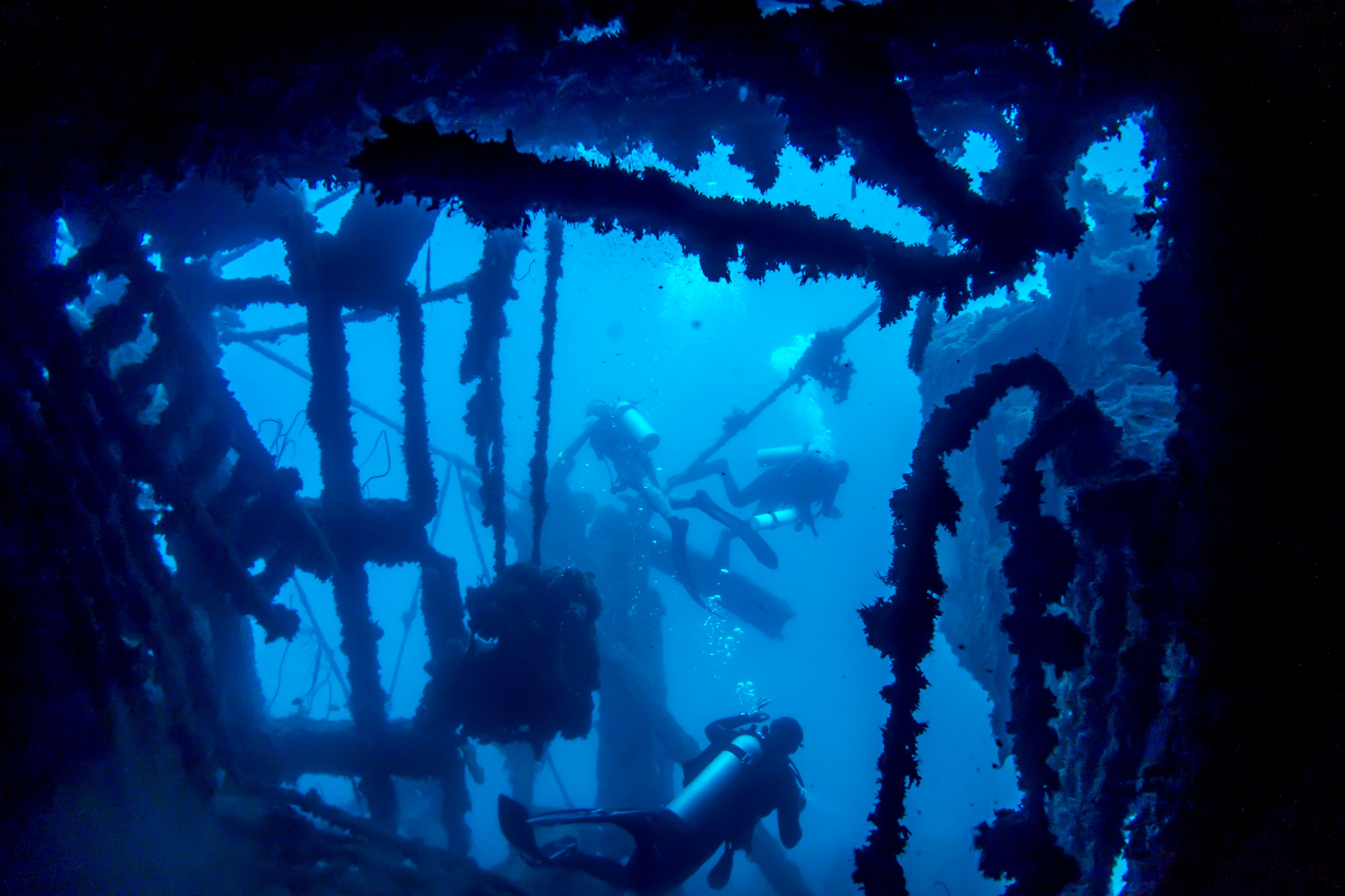 Divers in the wreck of the SS President Coolidge in Vanuatu Divers in the wreck of the SS President Coolidge in Vanuatu