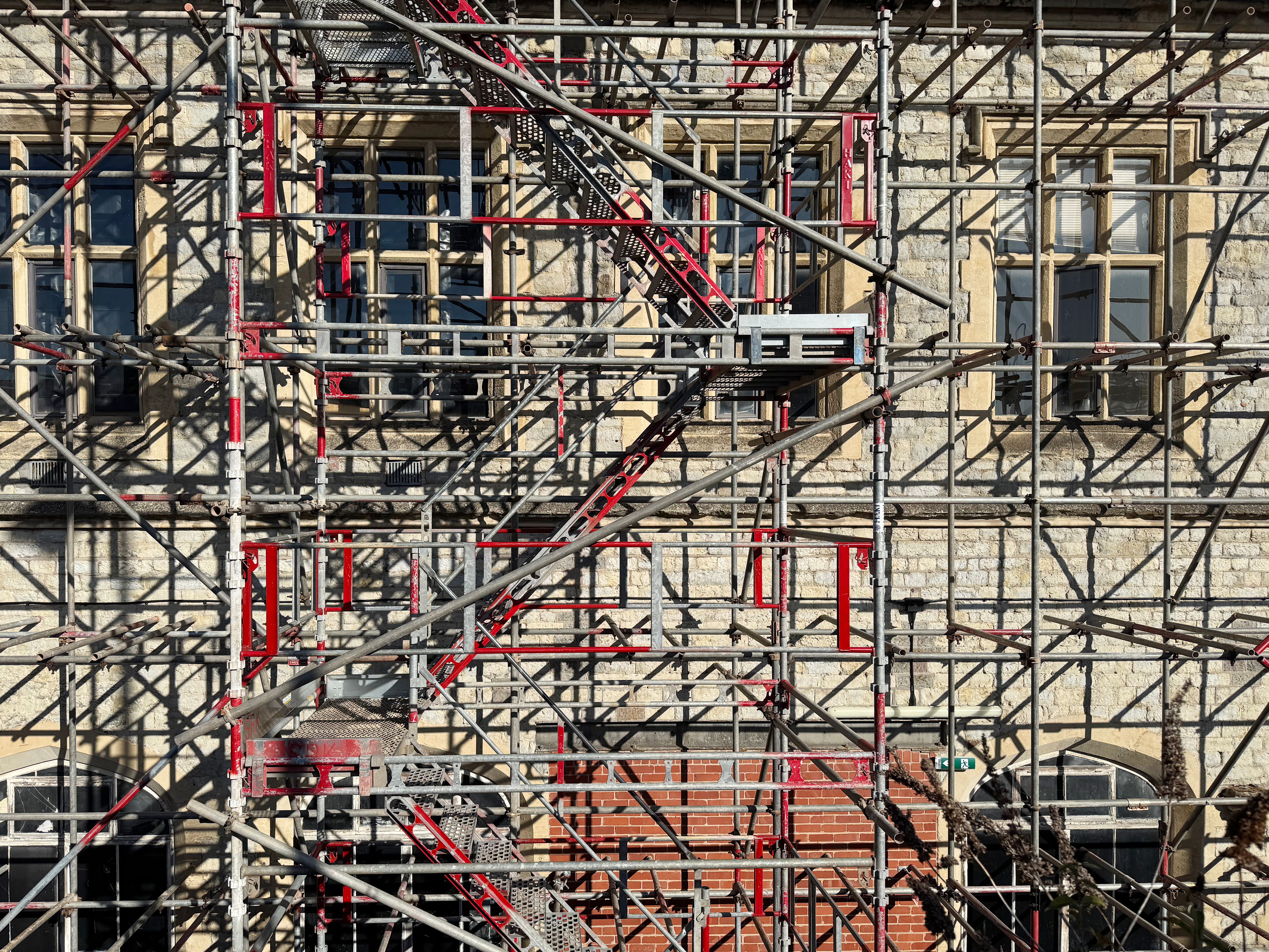 Stone building obscured by scaffolding Stone building obscured by scaffolding