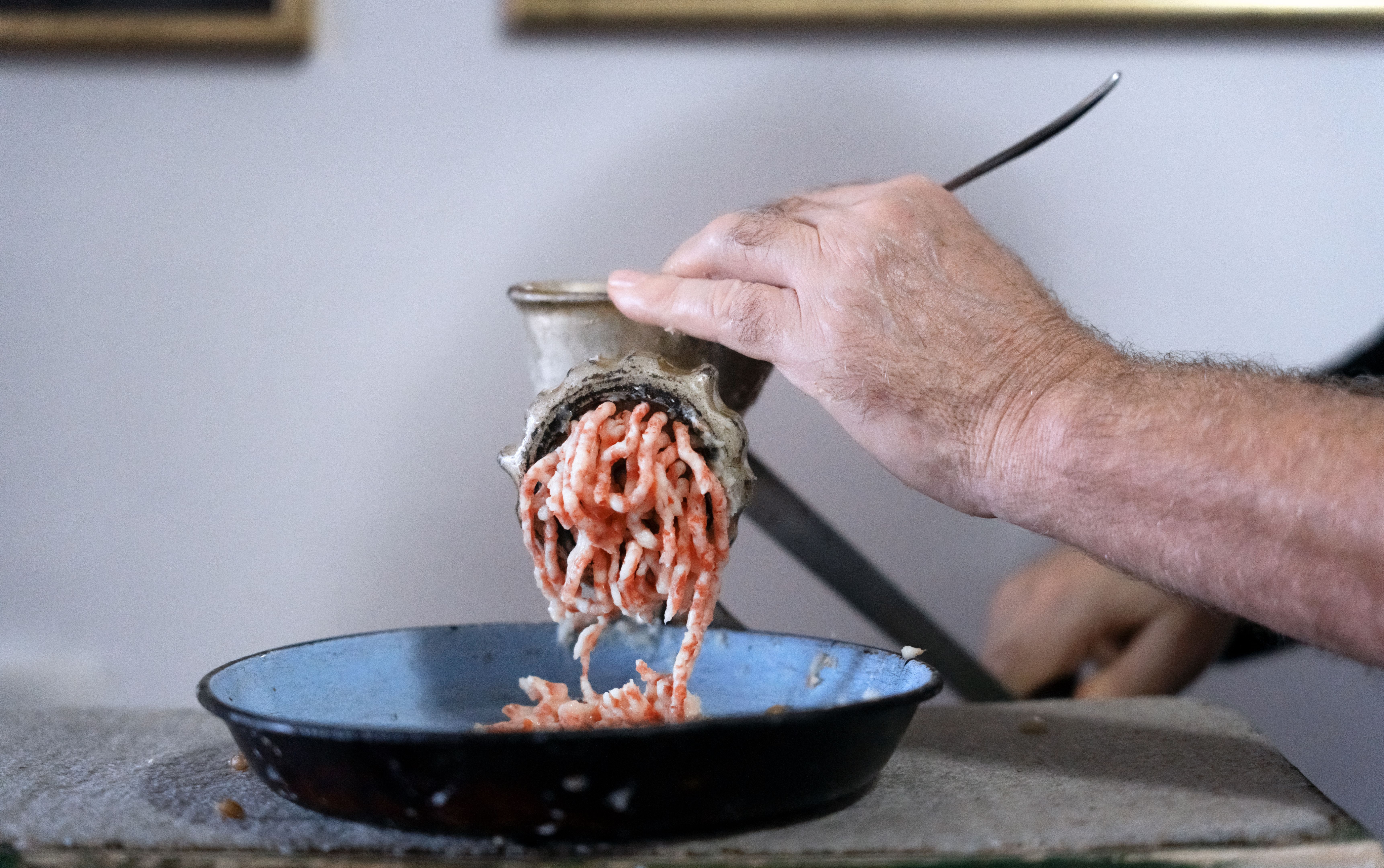 Manual meat grinding