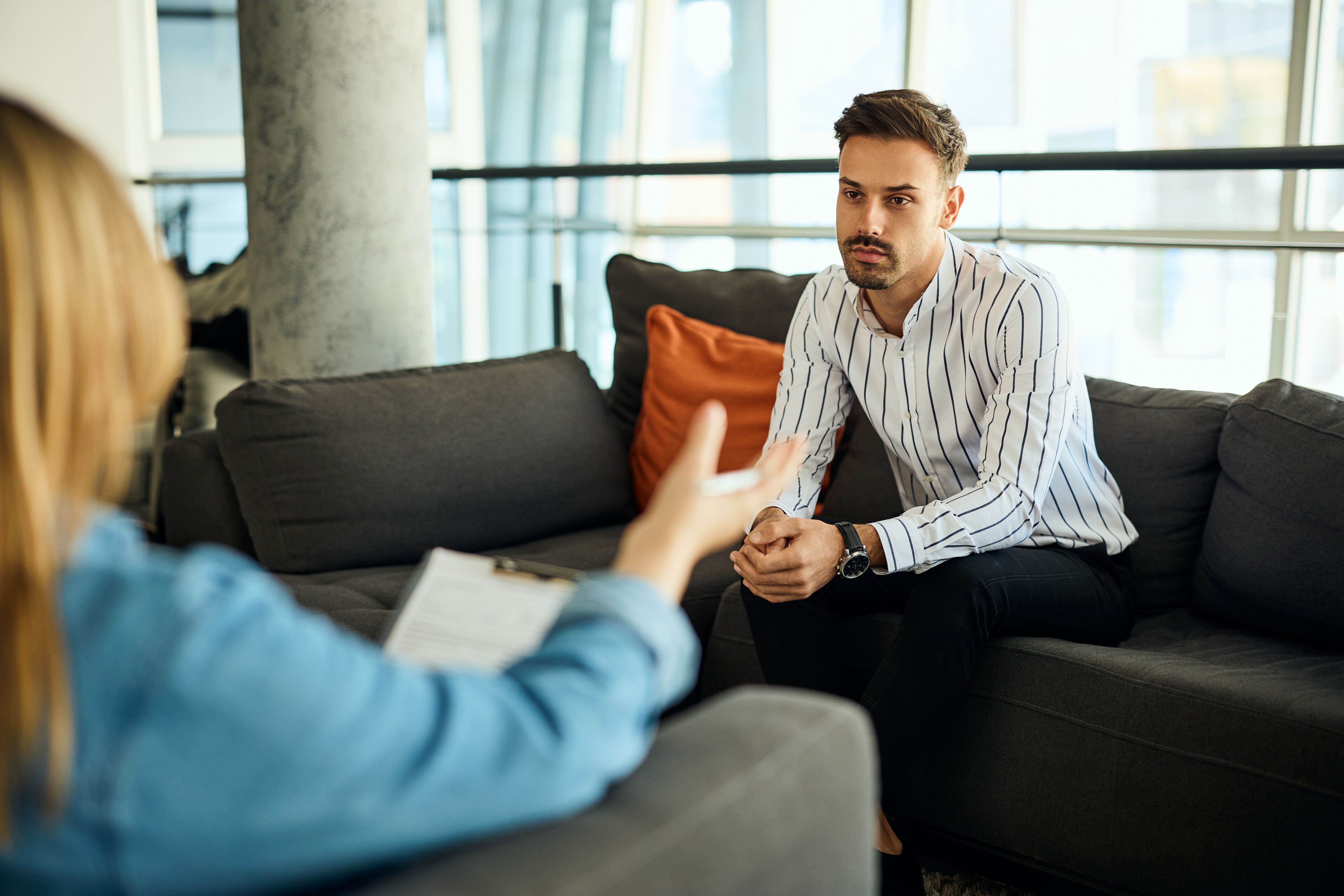 Professional Counseling Session in Modern Office Setting With Engaged Participants Professional Counseling Session in Modern Office Setting With Engaged Participants