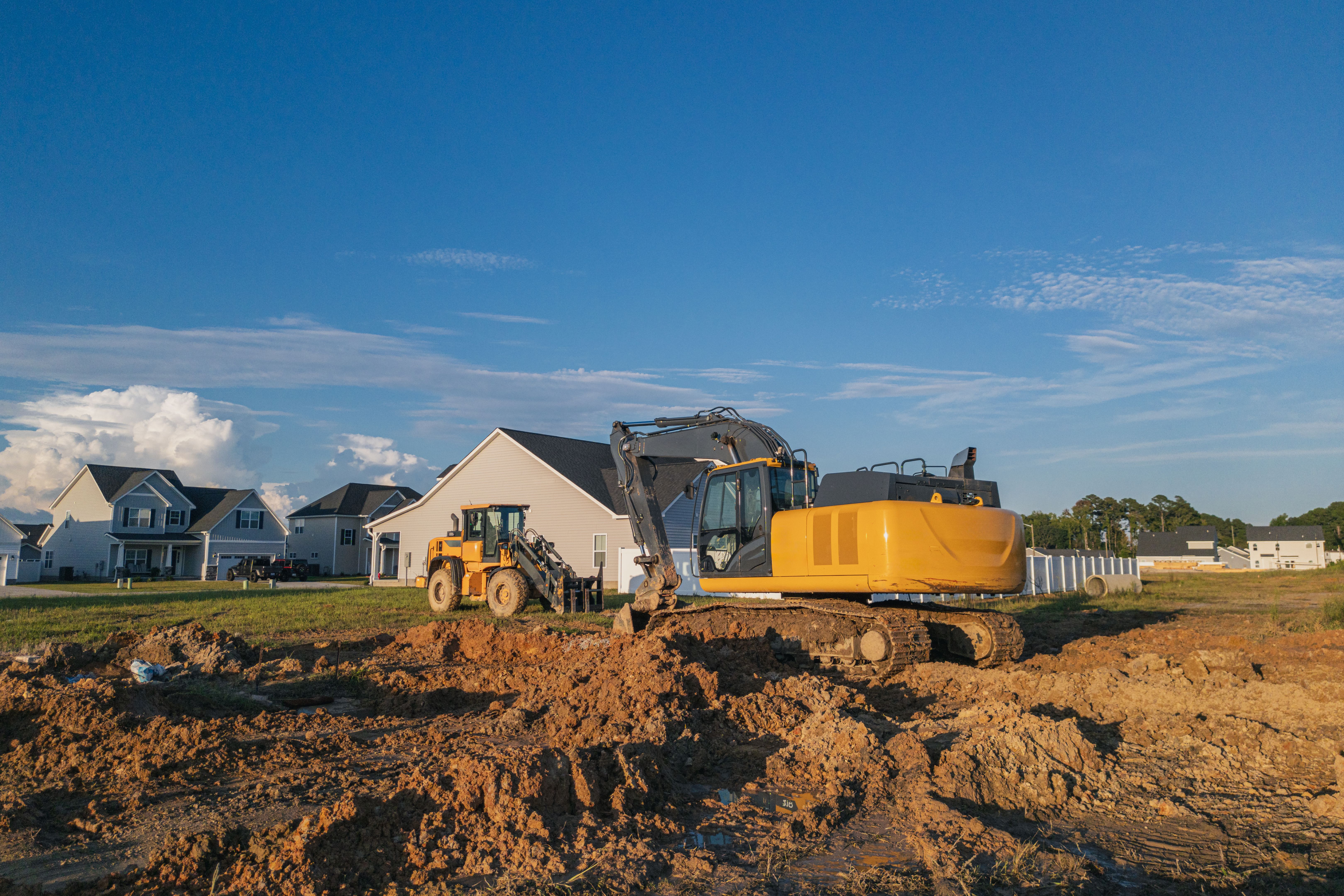 Excavator and Loader - Heavy Equipment - New Construction Home Site - North Carolina - Empty Lot - Wide Angle