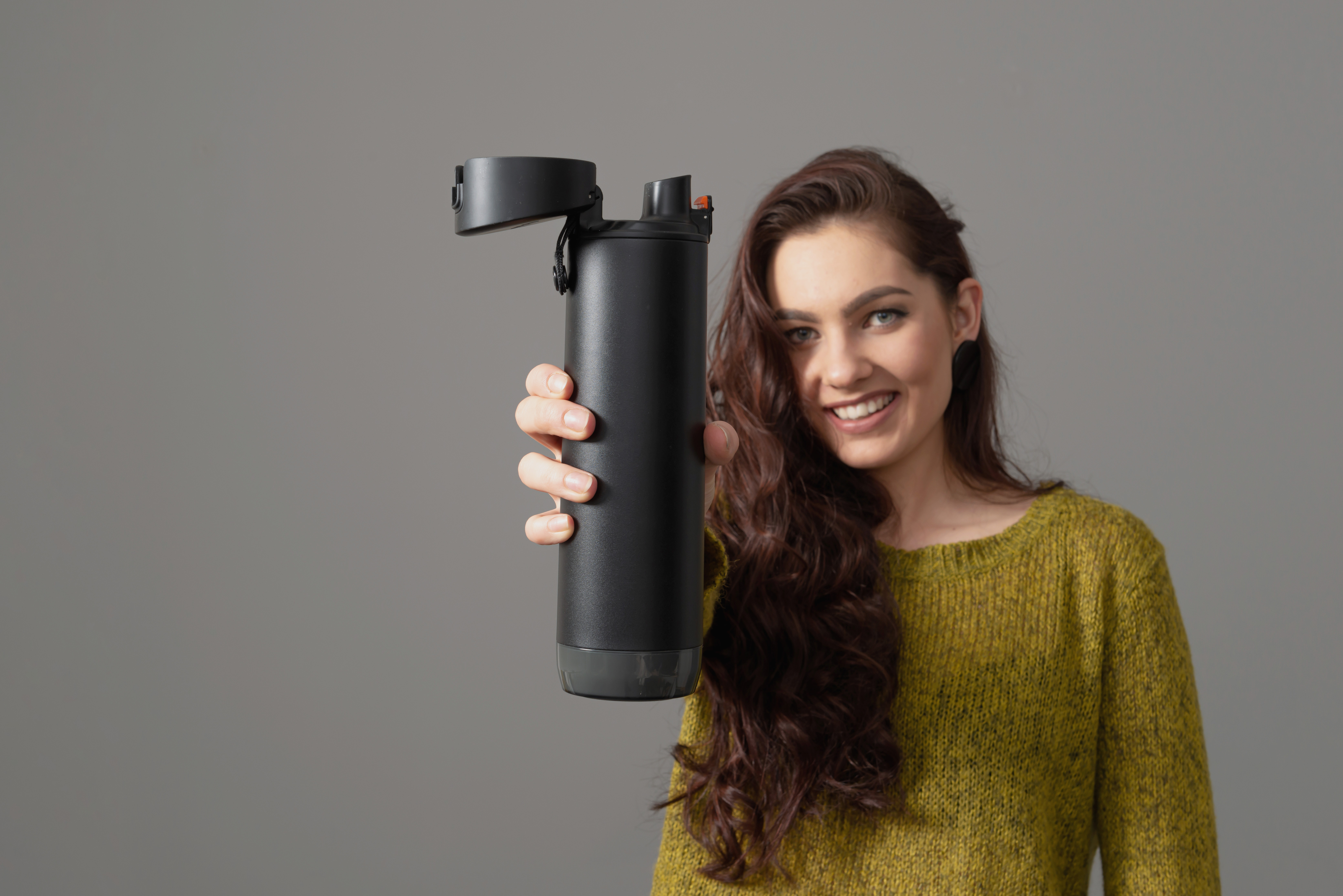 female holding eco reusable smart thermo water bottle with drink reminder, healthy lifestyle concept female holding eco reusable smart thermo water bottle with drink reminder, healthy lifestyle concept