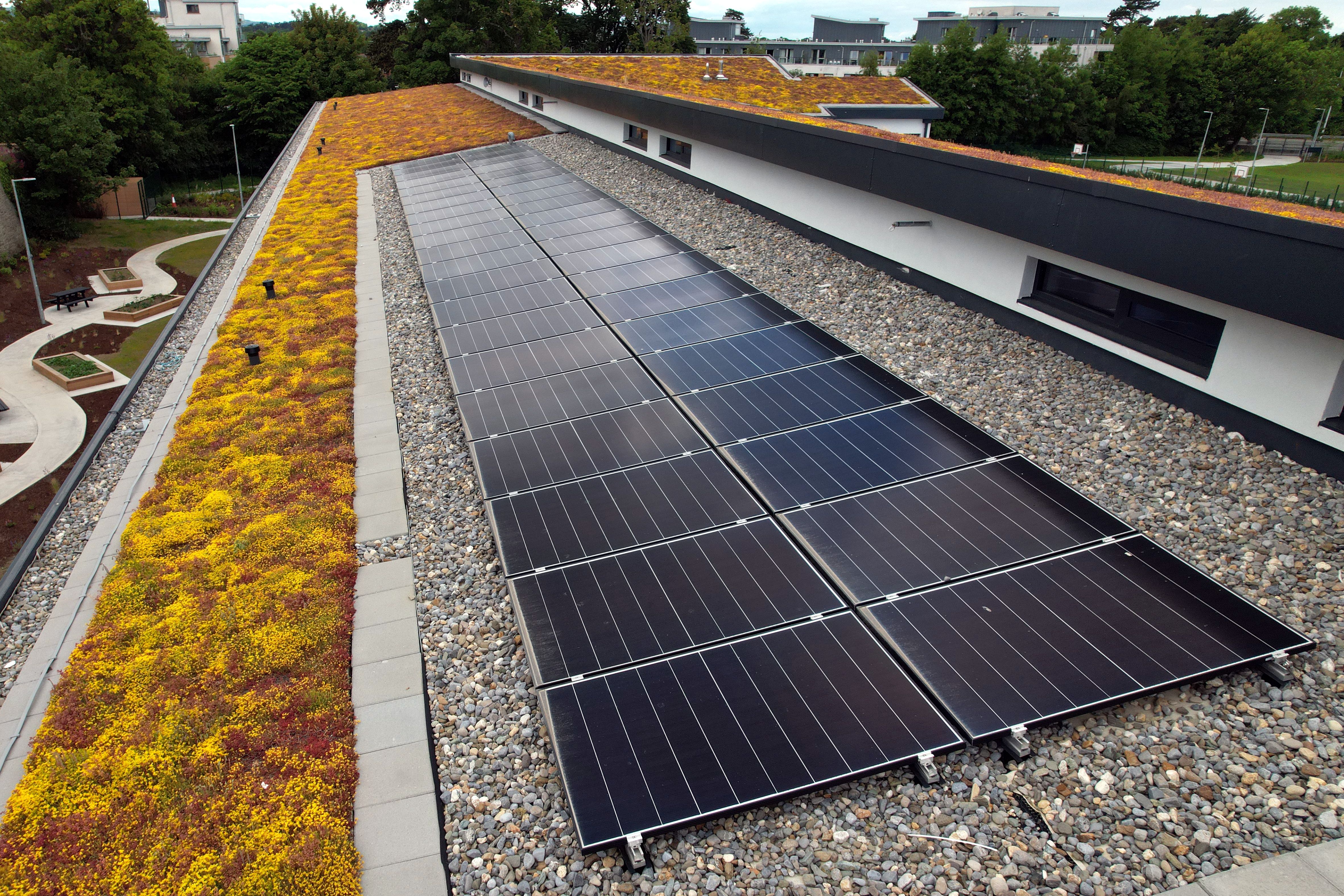 Energy efficient building, solar panels and green sod roof Energy efficient building, solar panels and green sod roof