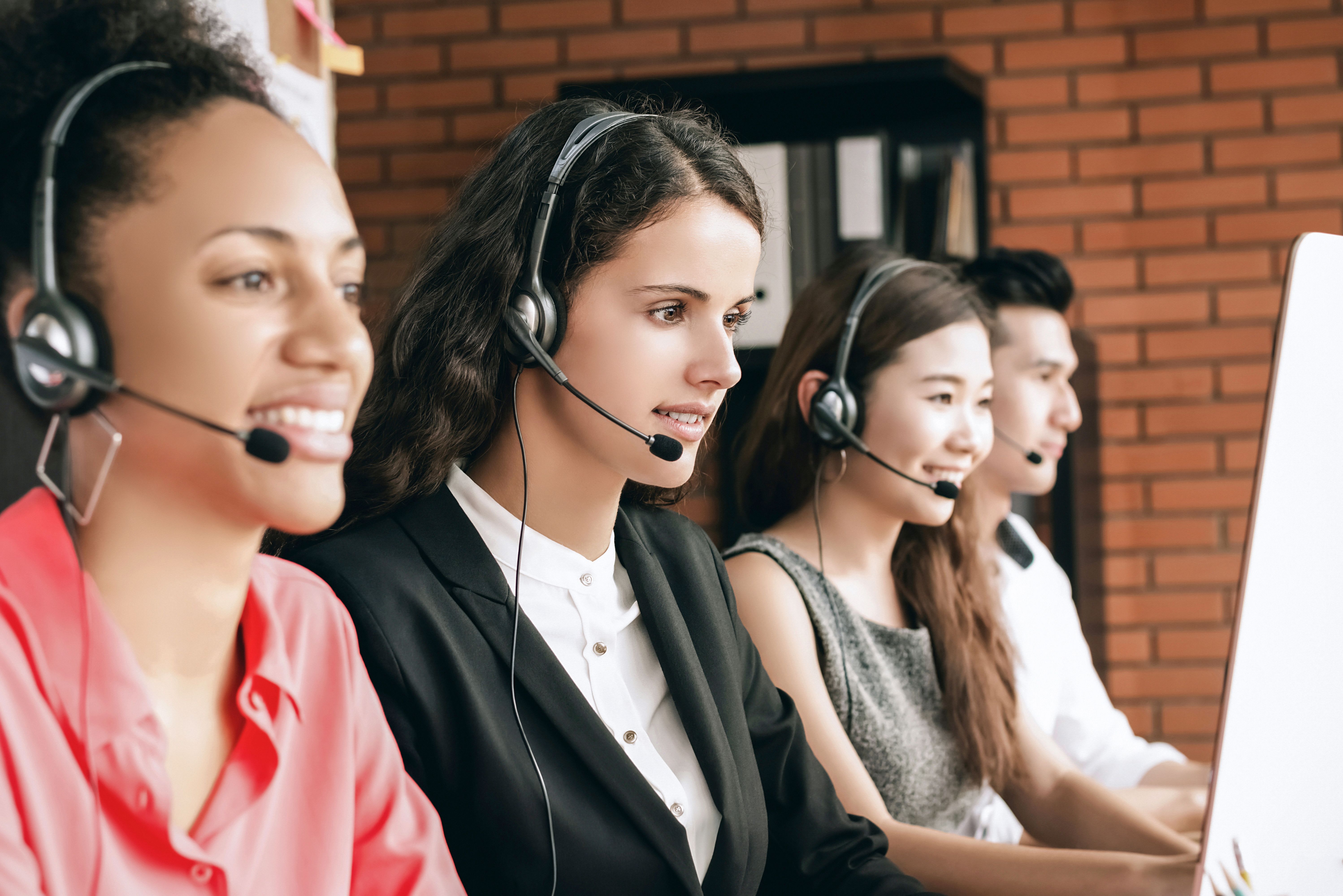 International call center telemarketing customer service team working in the office