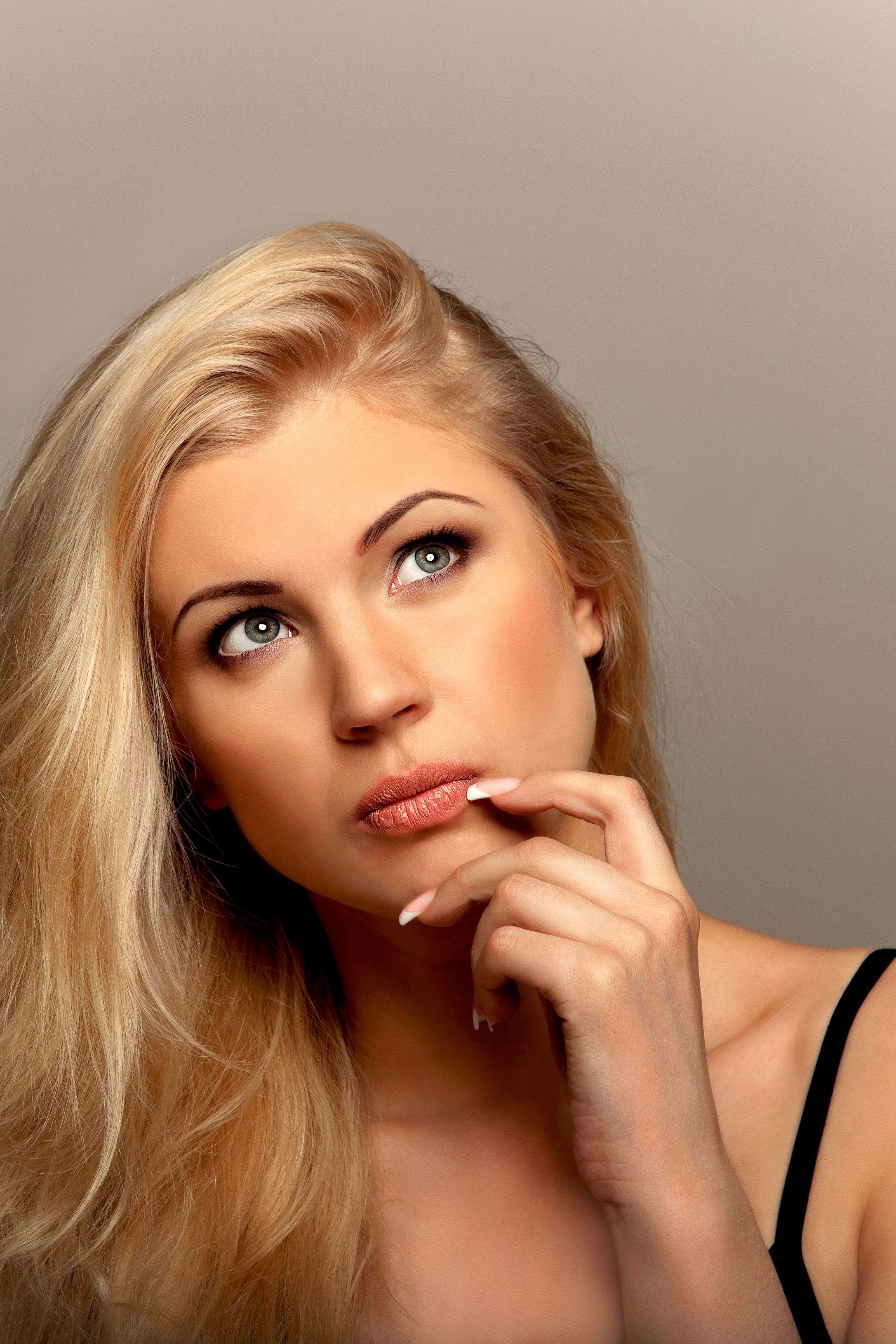 Woman thinking and looking up