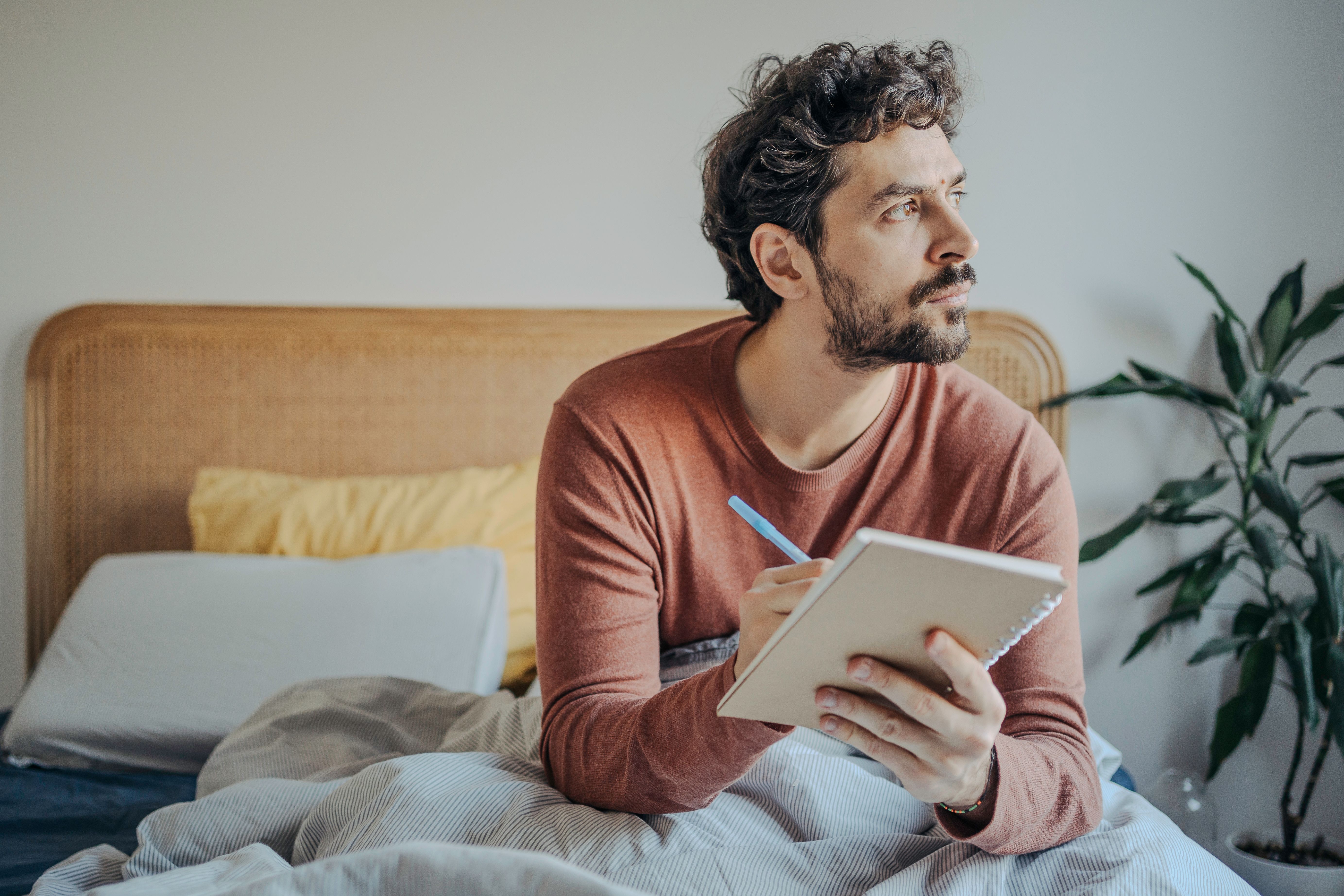 man journaling