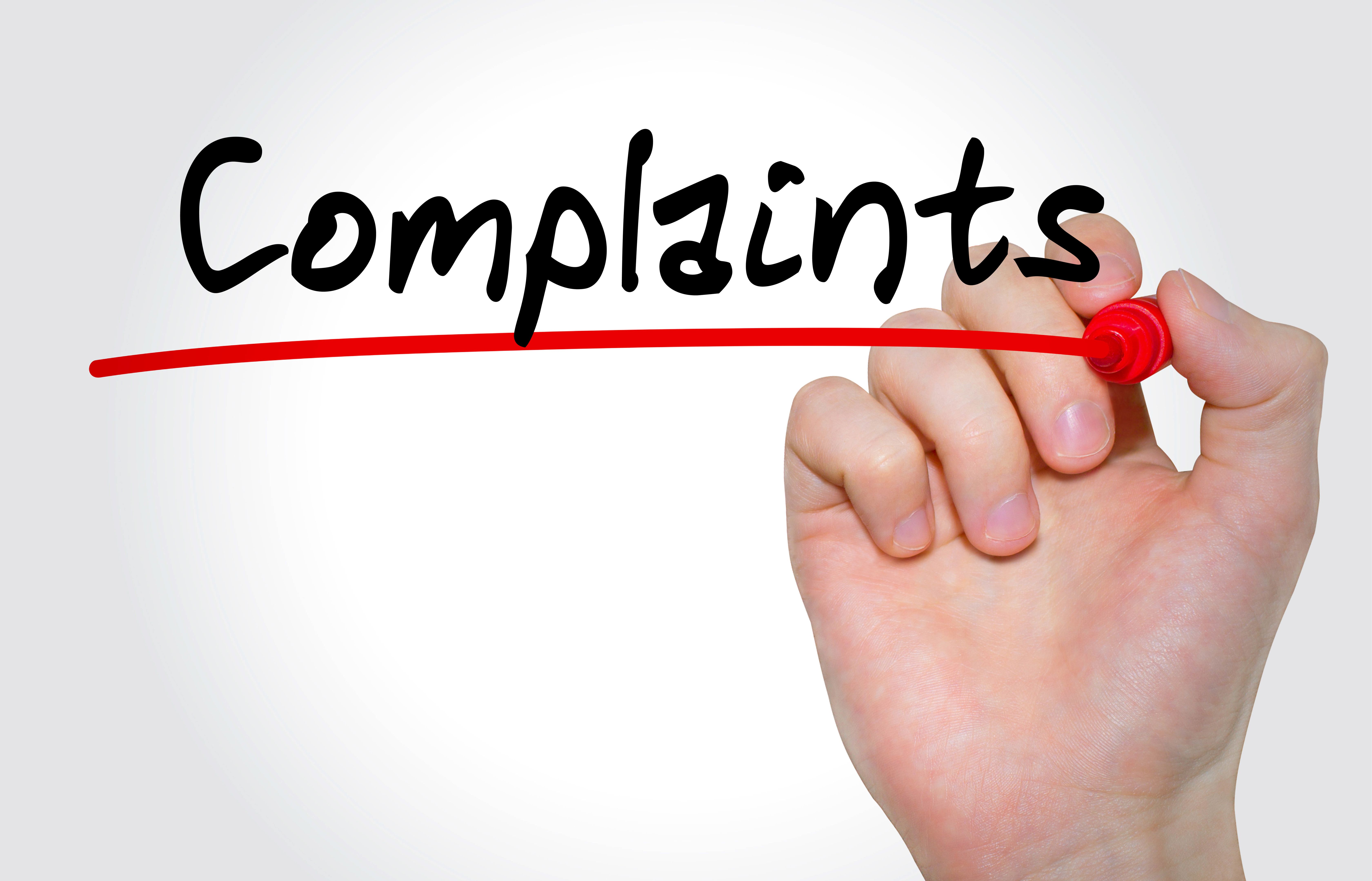 person writing complaint