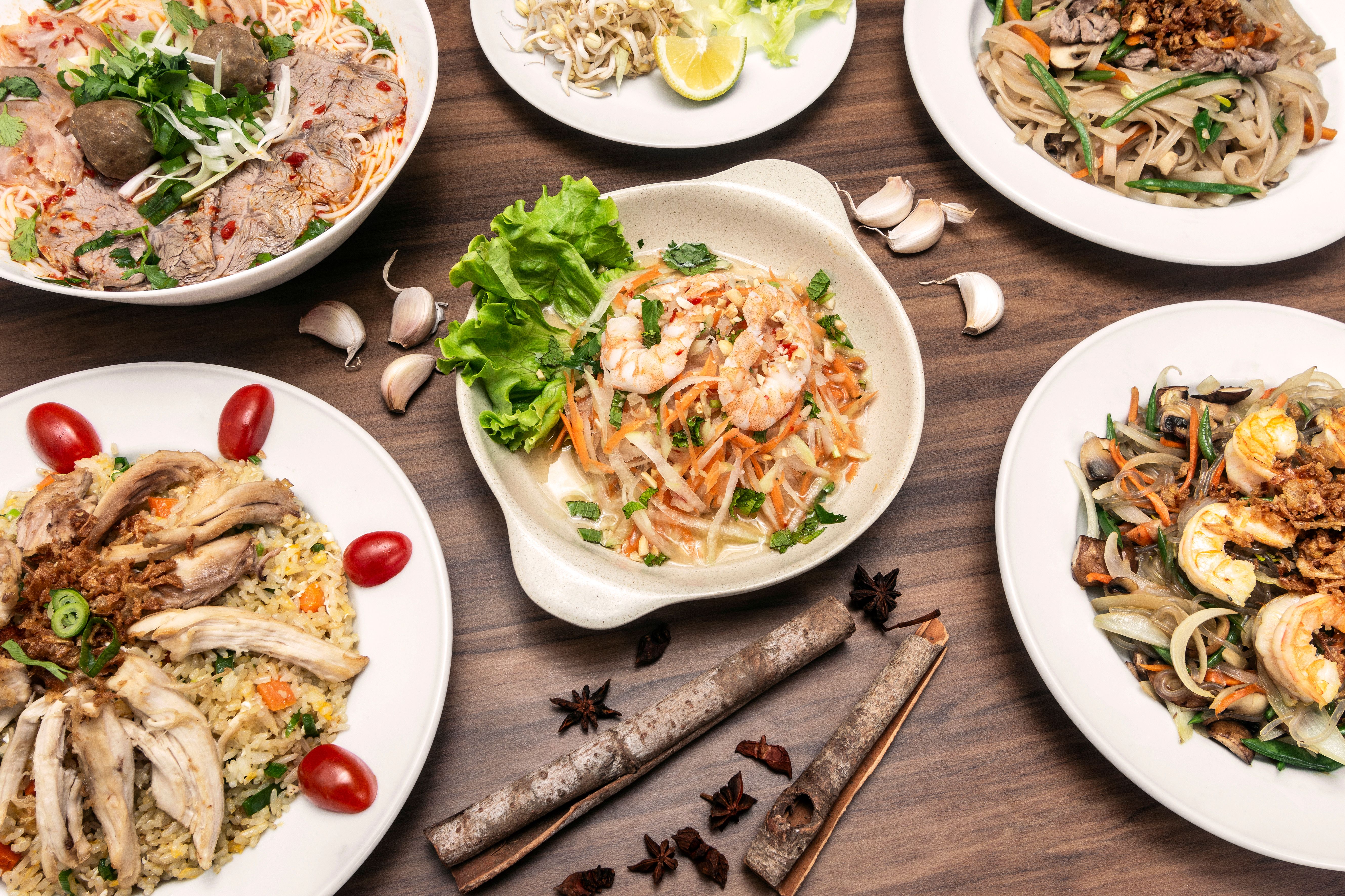 popular traditional vietnamese food dishes on restaurant table in vietnam