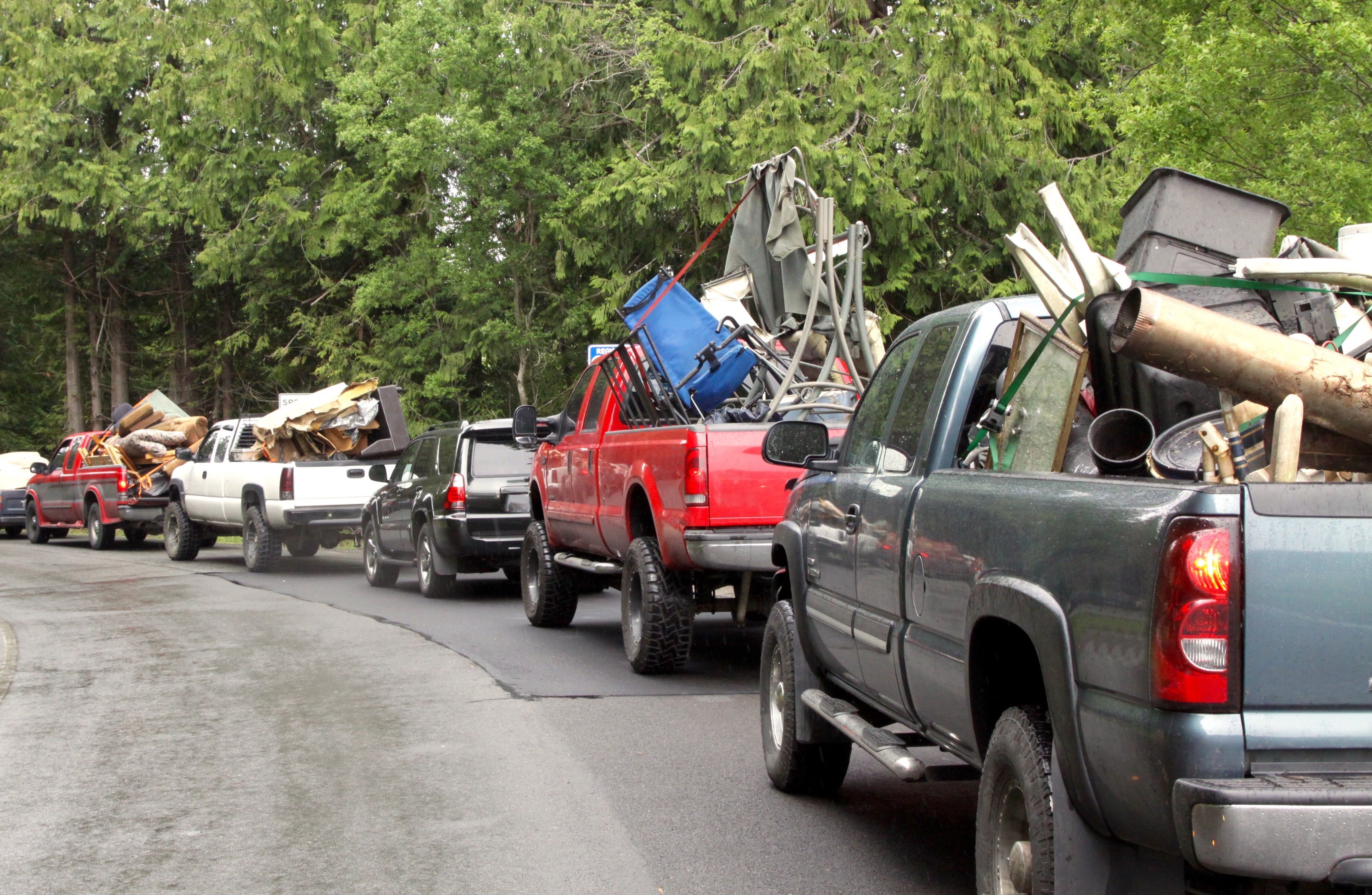 Long Line Up Of Trucks Heading For The City Dump