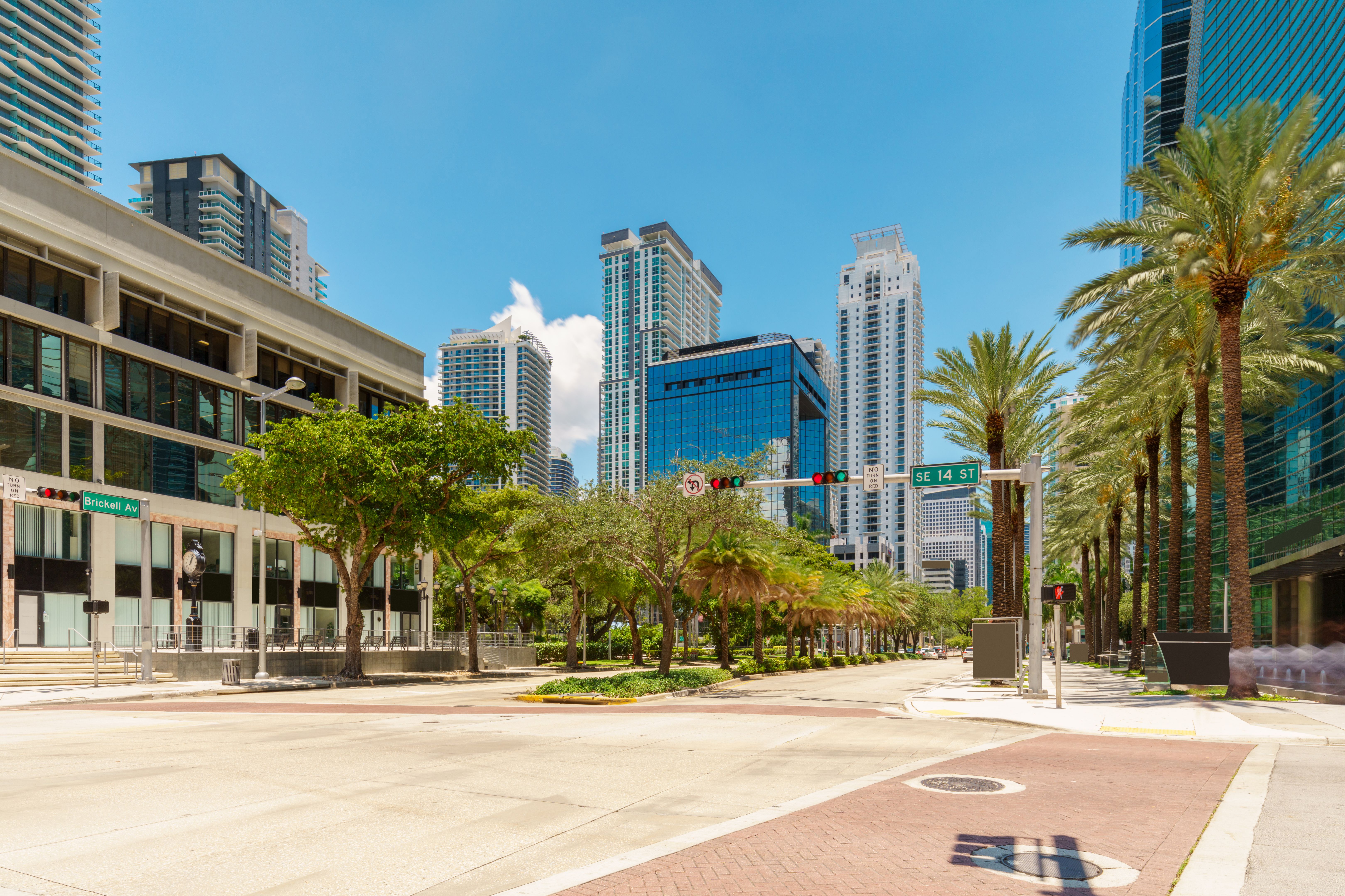 Miami Brickell, Florida, USA. View down Brickell Avenue and SE 14th Street 2024. Long exposure with motion blur people and traffic