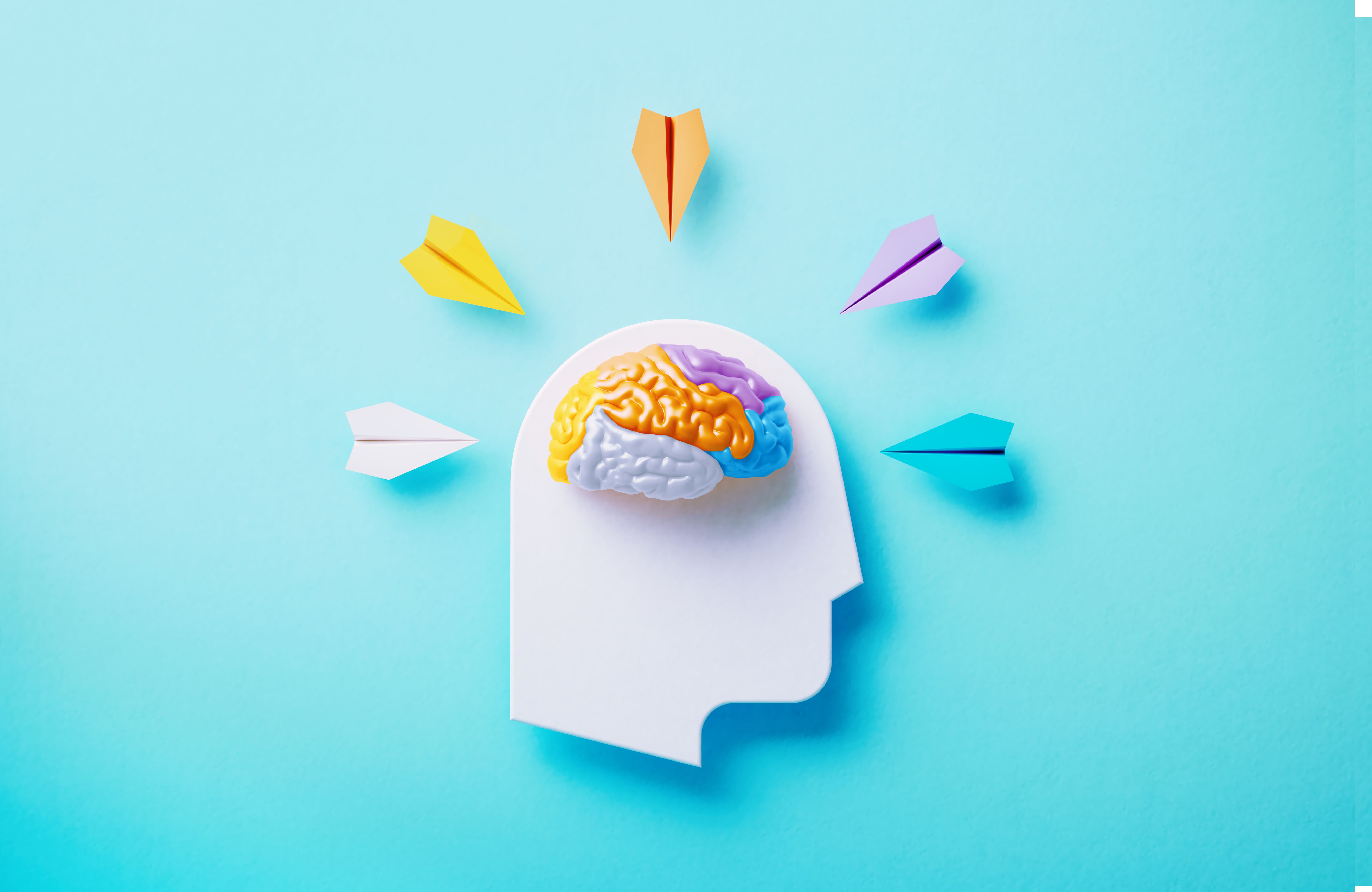 Neurodiversity And Creativity Concept - White Human Symbol And Colorful Paper Planes On Blue Background