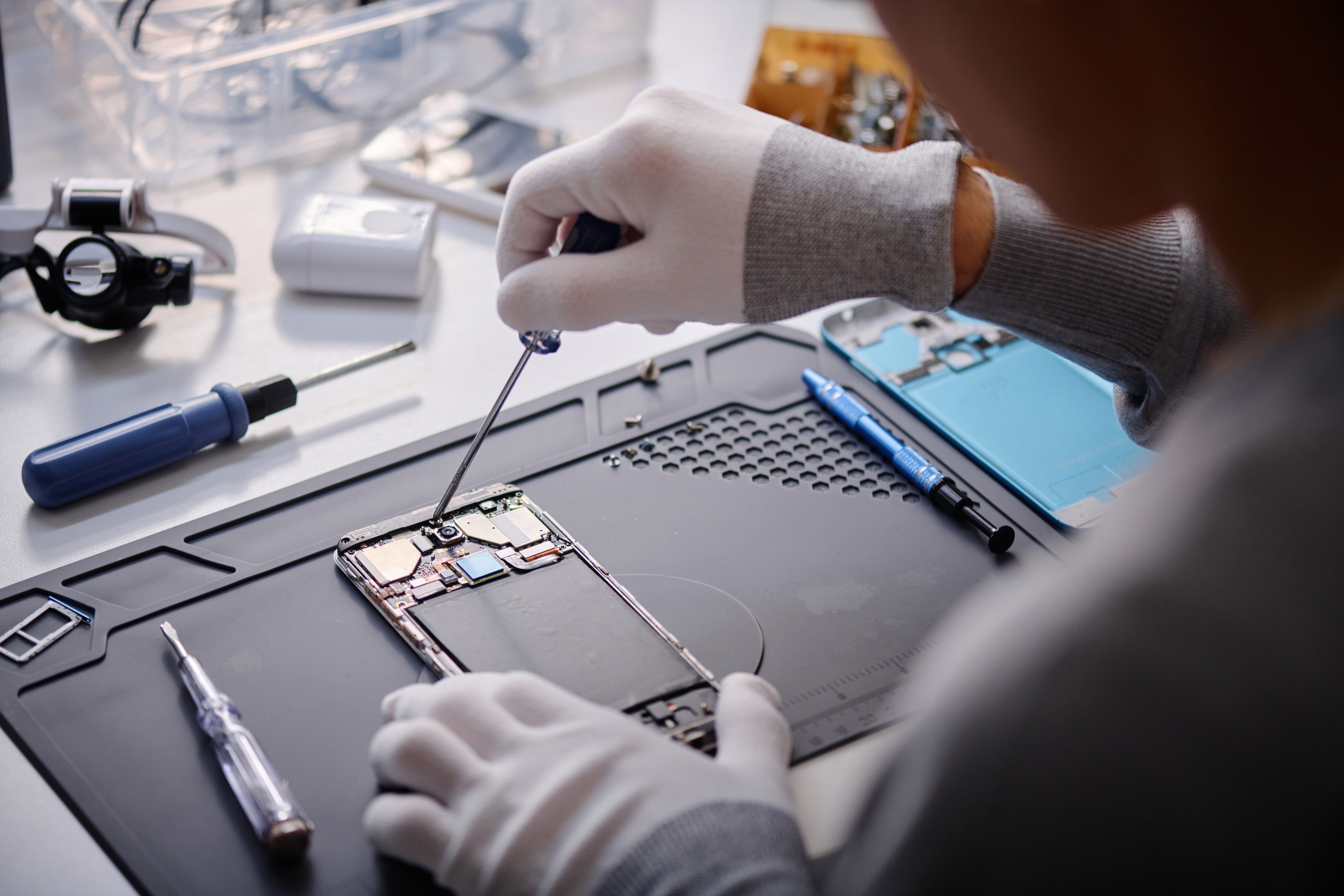 technician repairing tablet