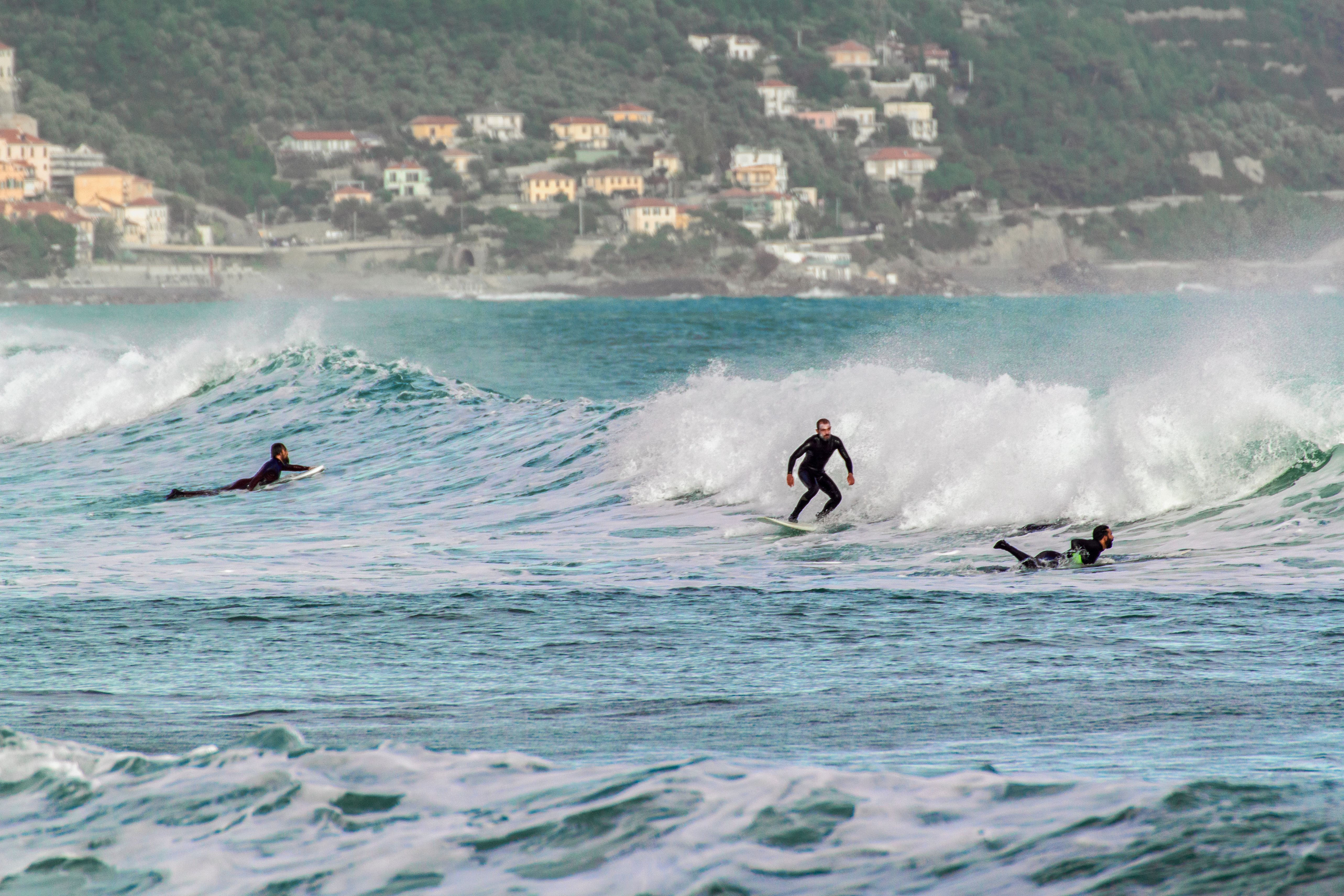 pro surfer rides the ligurian wave