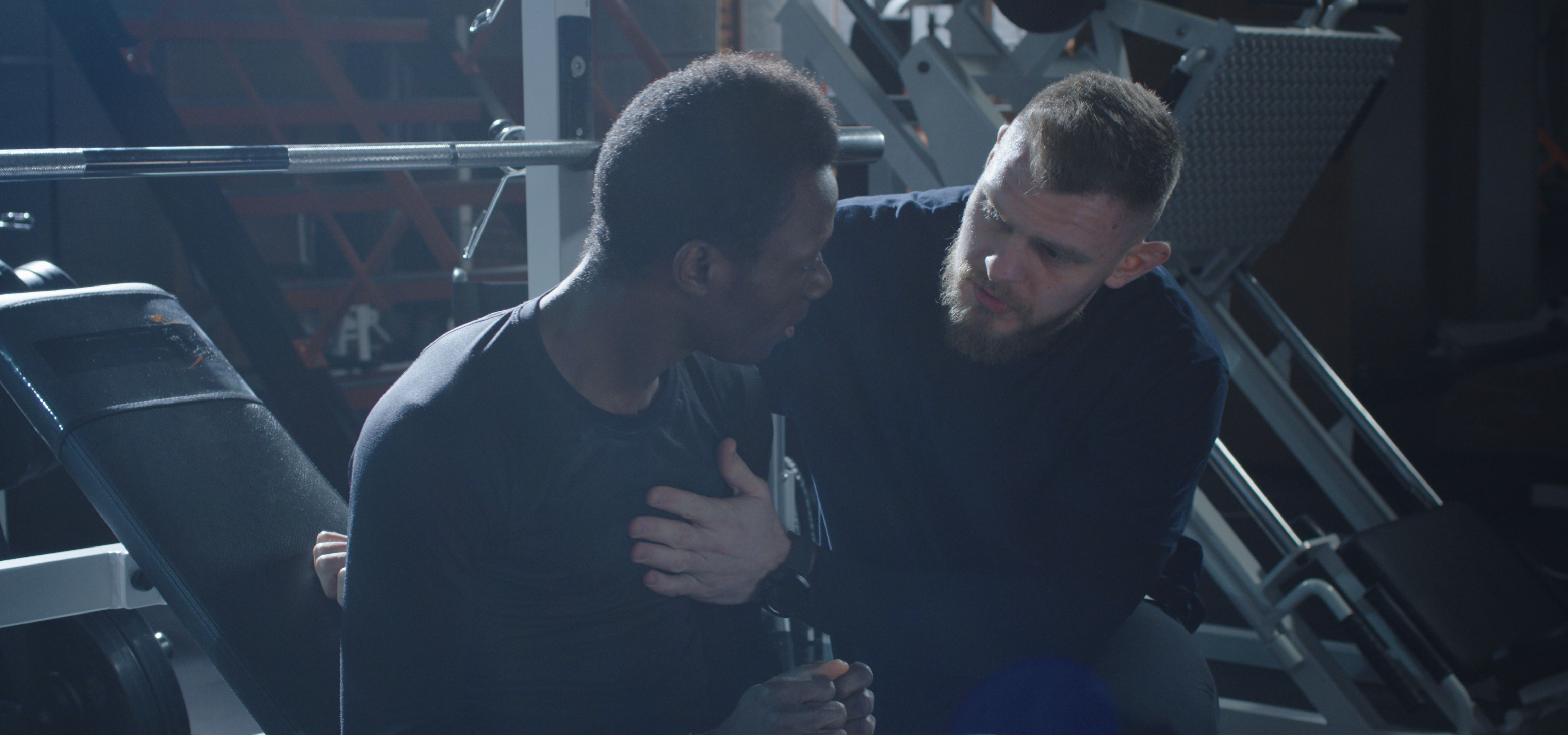 Trainer explaining exercise for beginner