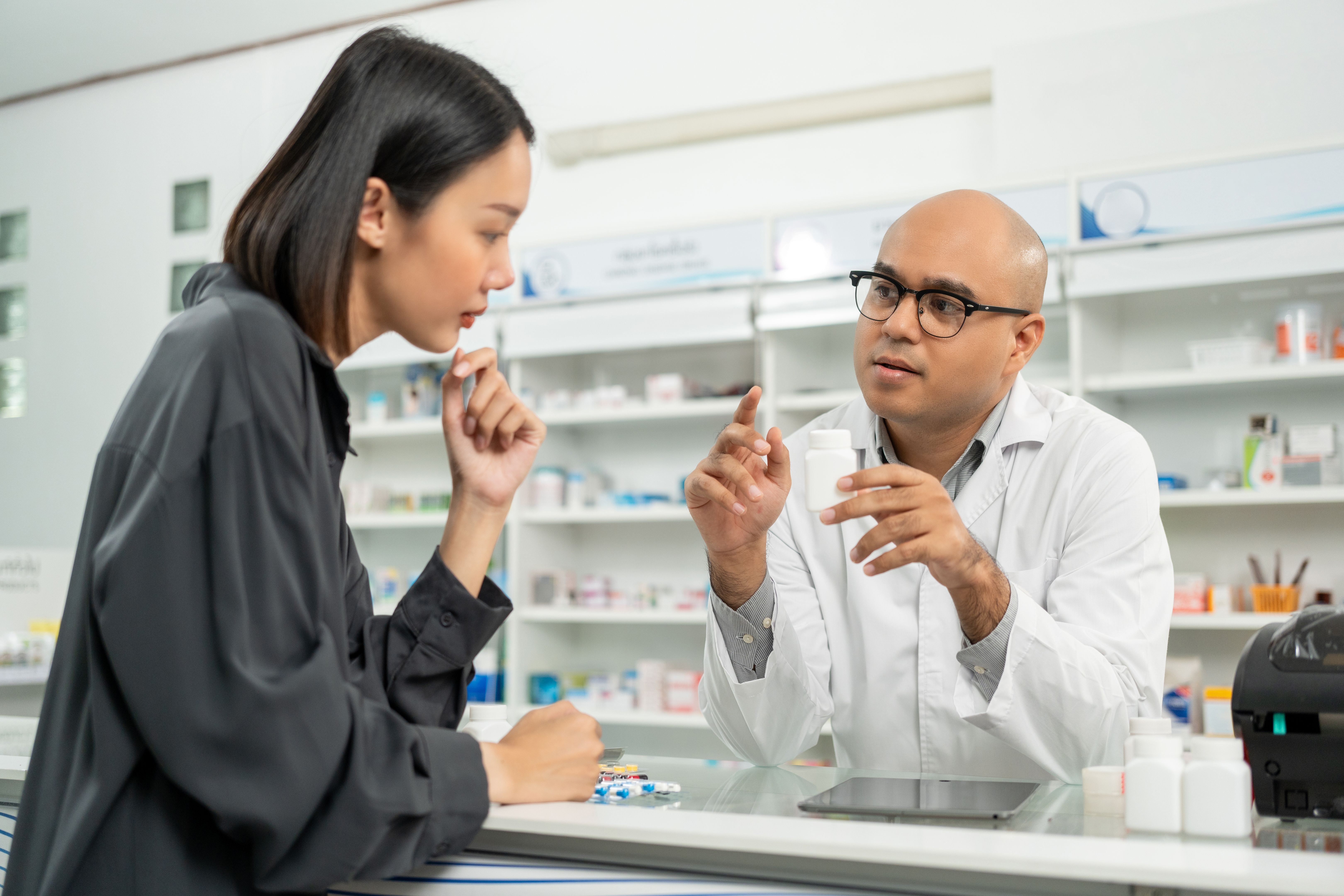 pharmacist with customer