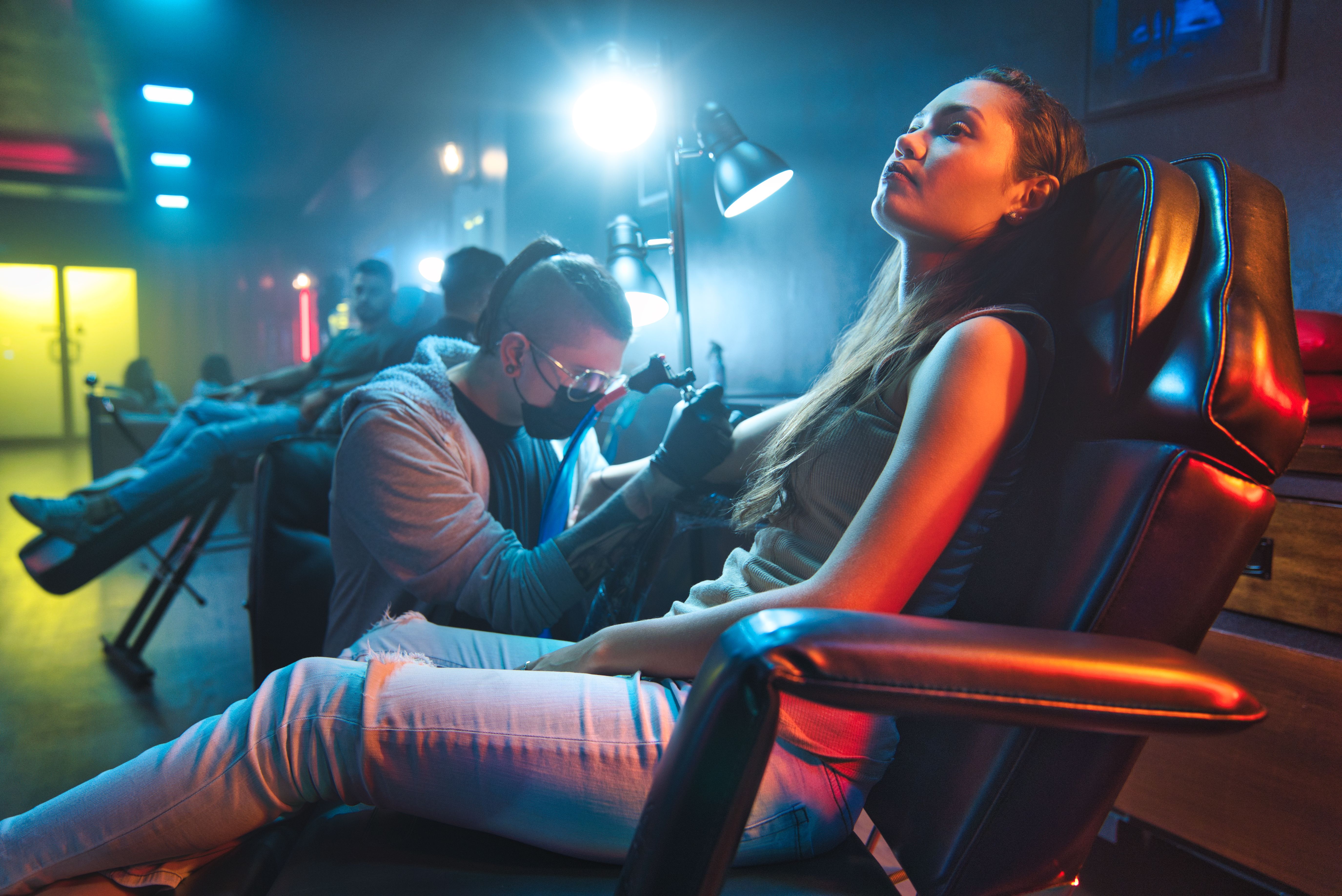 tattoo artist working